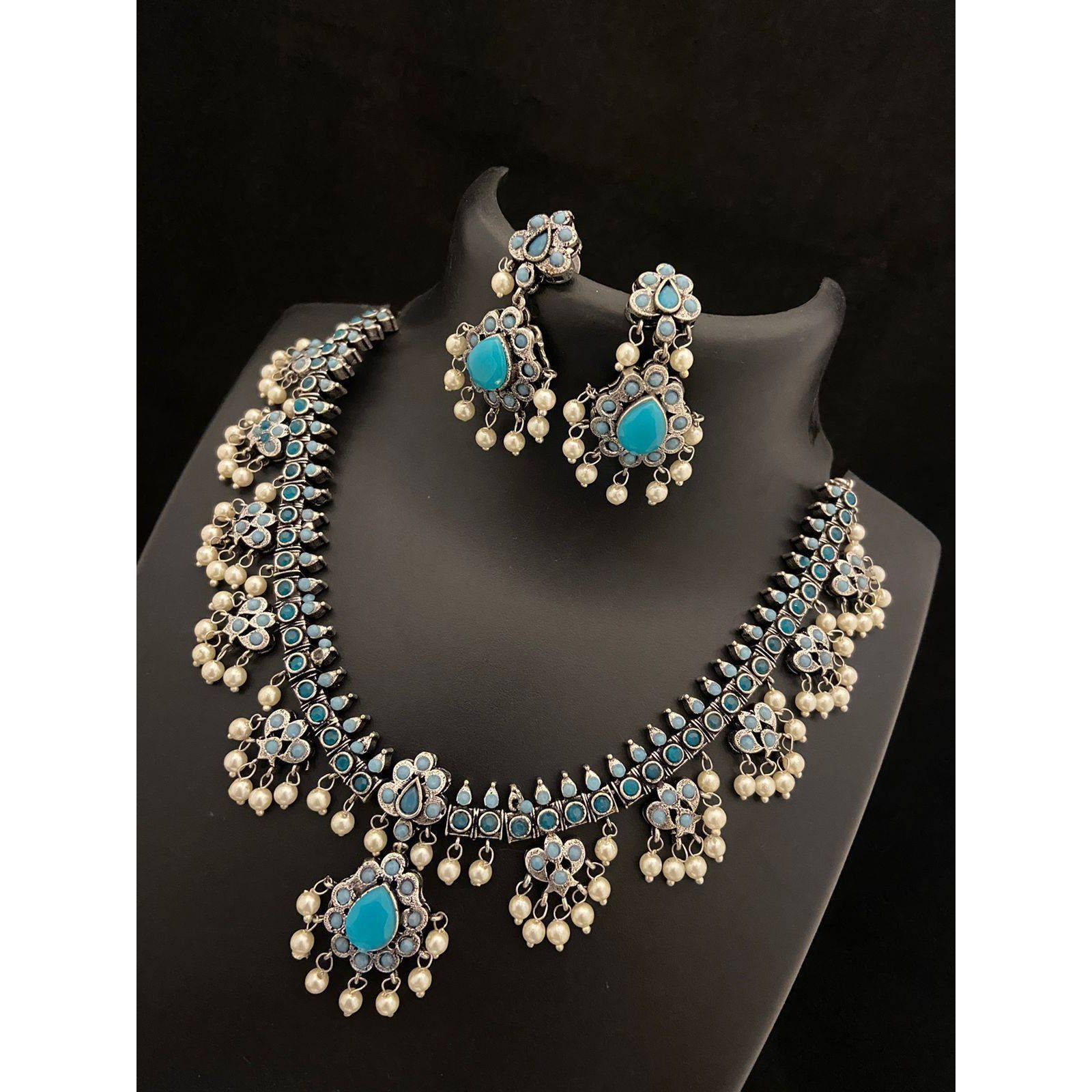 Dramatizing the classy hoops with colorful stones and dreamy pearls Our Peacock Multicolored Hoop Earrings is a classy affair of vintage and contemporary, Crafted in german silver, these earrings accentuate beauty with intricate peacock motifs with multicolored stones and pearls by the edge. A jewelry delight, these earrings will promise to dress you up and add a touch of glam to your look. Stylish and Versatile, these earrings are a must-have
