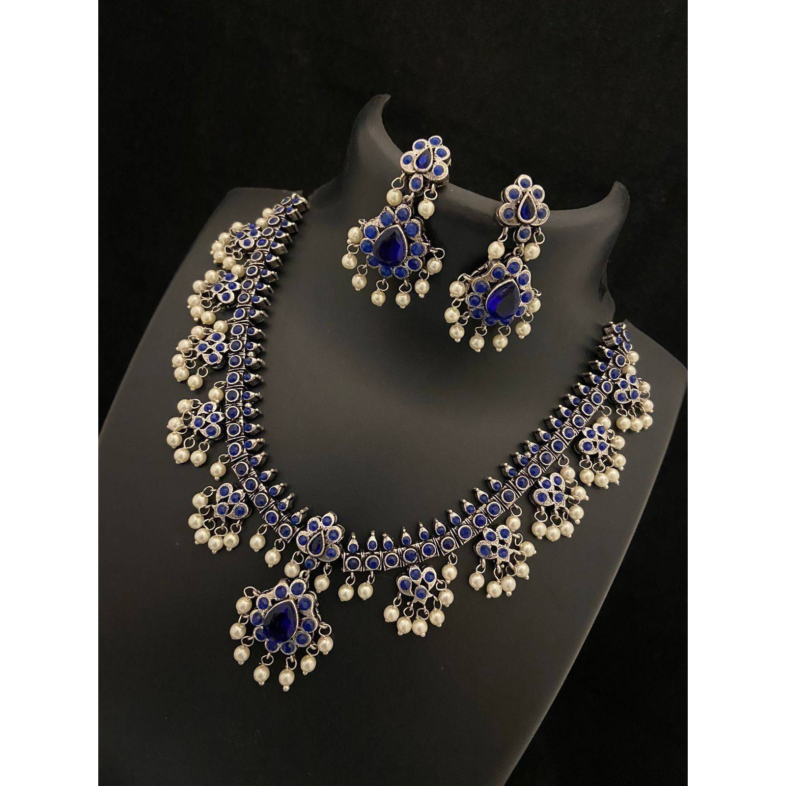 Dramatizing the classy hoops with colorful stones and dreamy pearls Our Peacock Multicolored Hoop Earrings is a classy affair of vintage and contemporary, Crafted in german silver, these earrings accentuate beauty with intricate peacock motifs with multicolored stones and pearls by the edge. A jewelry delight, these earrings will promise to dress you up and add a touch of glam to your look. Stylish and Versatile, these earrings are a must-have