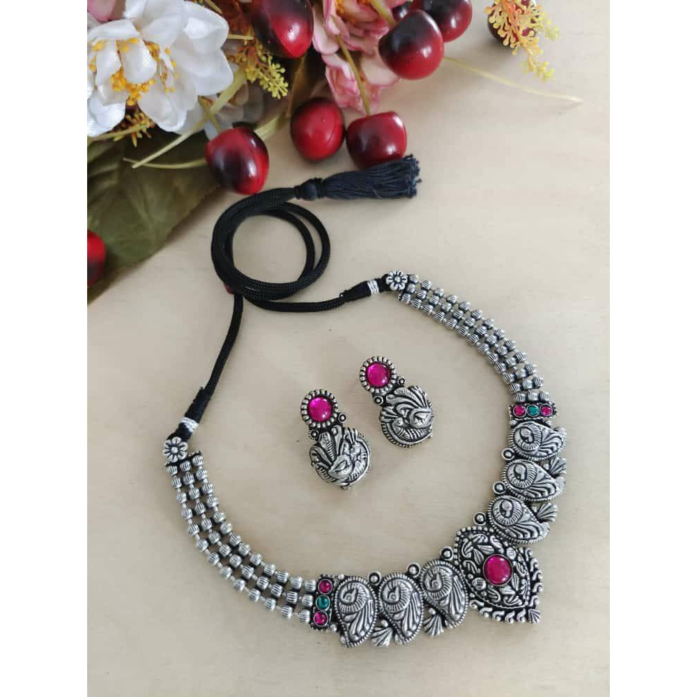This is a beautiful Indian jewelry that is handcrafted and made in india. The jewelry comes in the pack of one silver looking necklace and a matching pair of earrings. The oxidized necklace is embedded with green stones and so is the earrings. This piece will prove to be a treasure in your cupboard. On buying this jewelry set get a free and assured gift on every purchase.Care Instruction To maintain the shine of the jewelry make sure to clean with a clean white tissue or cloth. Do not use any h