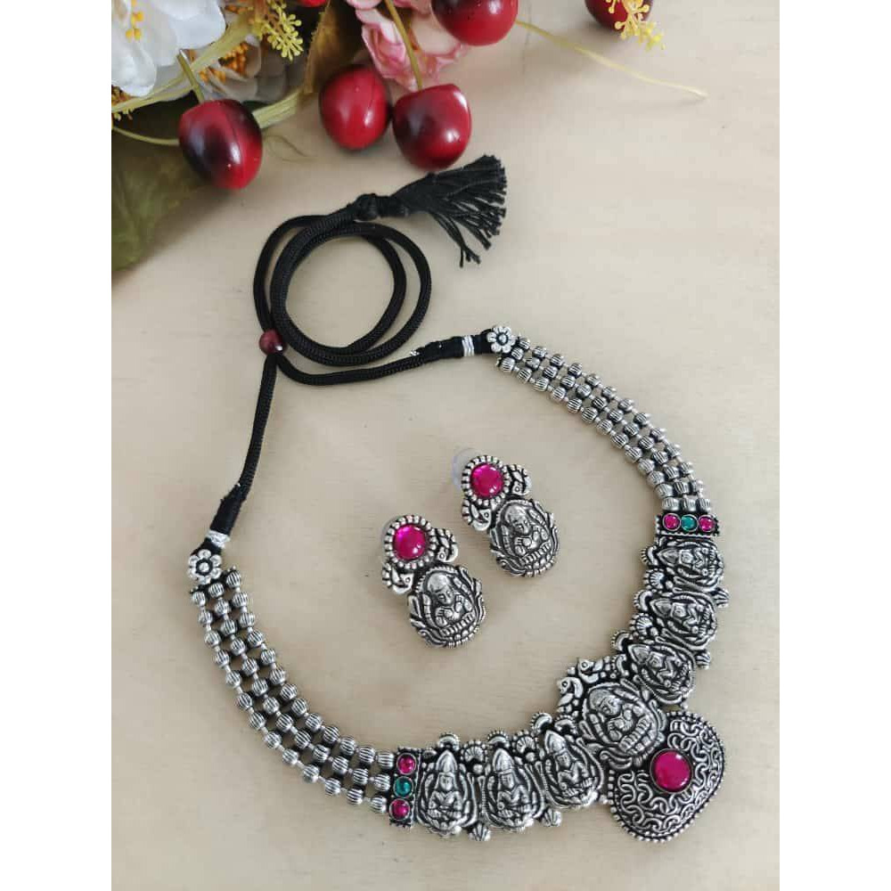 This is a beautiful Indian jewelry that is handcrafted and made in india. The jewelry comes in the pack of one silver looking necklace and a matching pair of earrings. The oxidized necklace is embedded with green stones and so is the earrings. This piece will prove to be a treasure in your cupboard. On buying this jewelry set get a free and assured gift on every purchase.Care Instruction To maintain the shine of the jewelry make sure to clean with a clean white tissue or cloth. Do not use any h