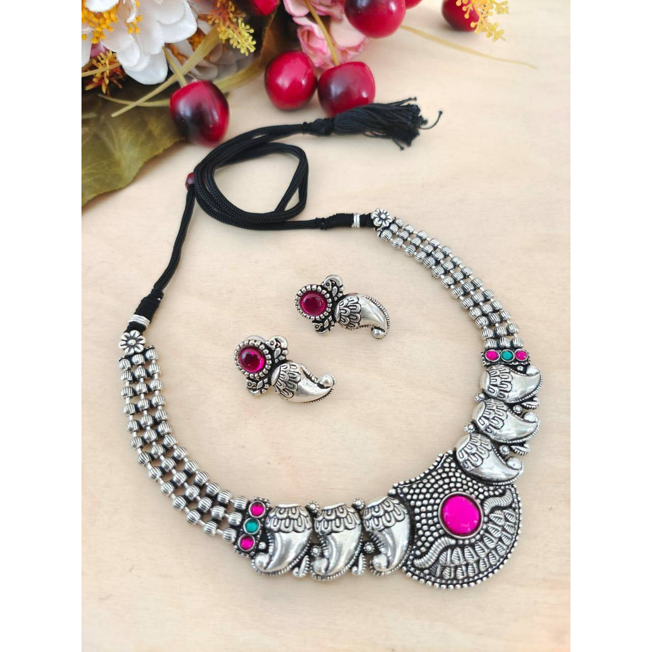 This is a beautiful Indian jewelry that is handcrafted and made in india. The jewelry comes in the pack of one silver looking necklace and a matching pair of earrings. The oxidized necklace is embedded with green stones and so is the earrings. This piece will prove to be a treasure in your cupboard. On buying this jewelry set get a free and assured gift on every purchase.Care Instruction To maintain the shine of the jewelry make sure to clean with a clean white tissue or cloth. Do not use any h