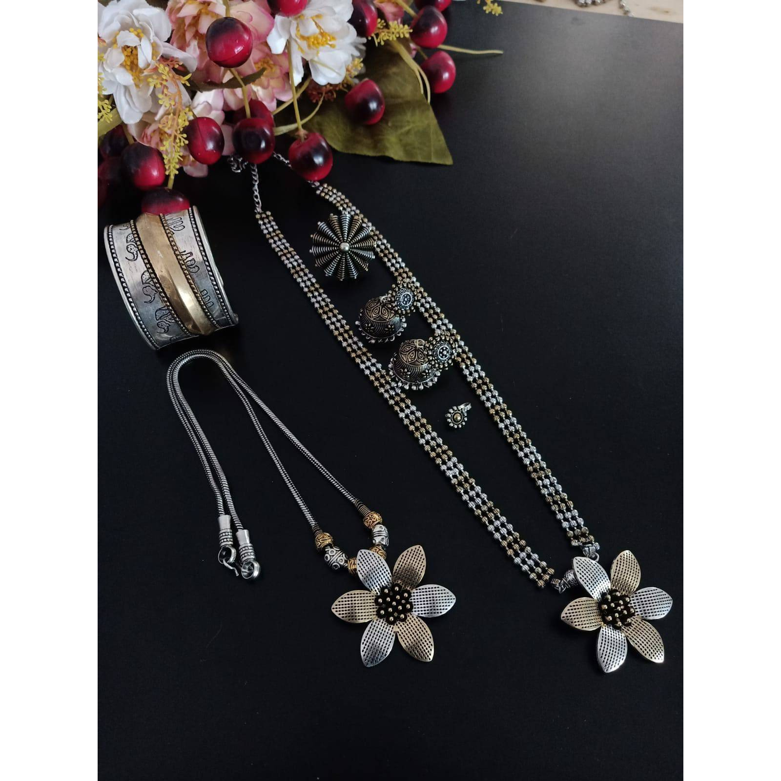It is an oxidized Indian jewelry with a tribal look. In this pack you will get four similar looking oxidized bangles along with an oxidized ring. The bangles have ghunghroo attached with the bangles that give it a unique look. This jewelry will go perfectly with an Indian outfit. This Indian jewelry set can also be worn in parties and is also ideal for everyday use. This set will also make a perfect gift for your loved ones. You will also get an assured gift with every purchase.Care Instruction