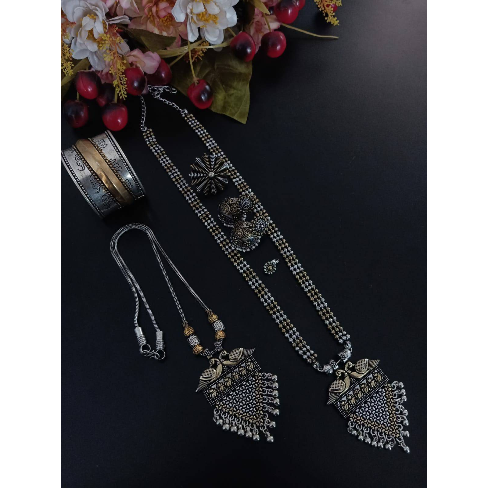 It is an oxidized Indian jewelry with a tribal look. In this pack you will get four similar looking oxidized bangles along with an oxidized ring. The bangles have ghunghroo attached with the bangles that give it a unique look. This jewelry will go perfectly with an Indian outfit. This Indian jewelry set can also be worn in parties and is also ideal for everyday use. This set will also make a perfect gift for your loved ones. You will also get an assured gift with every purchase.Care Instruction