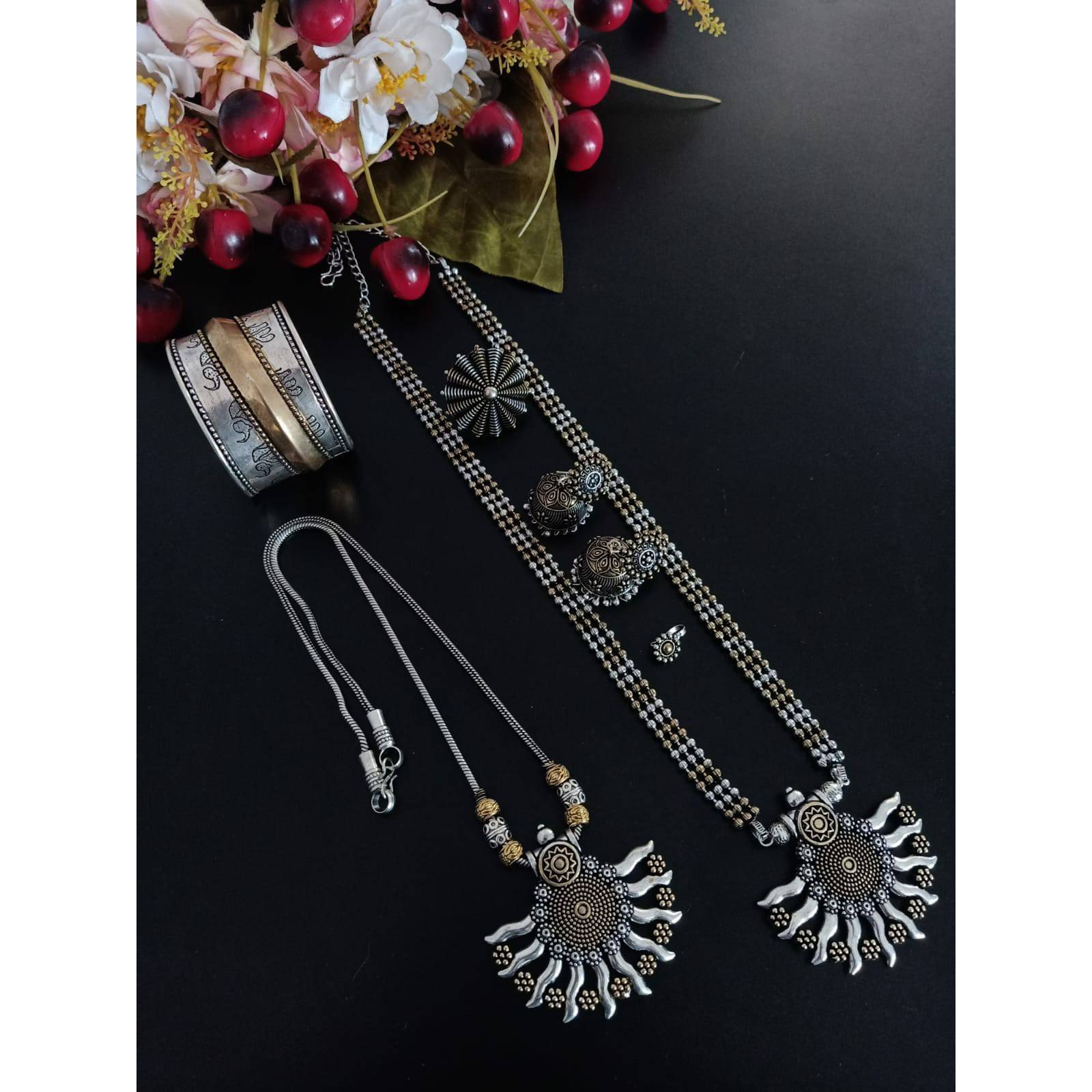 It is an oxidized Indian jewelry with a tribal look. In this pack you will get four similar looking oxidized bangles along with an oxidized ring. The bangles have ghunghroo attached with the bangles that give it a unique look. This jewelry will go perfectly with an Indian outfit. This Indian jewelry set can also be worn in parties and is also ideal for everyday use. This set will also make a perfect gift for your loved ones. You will also get an assured gift with every purchase.Care Instruction