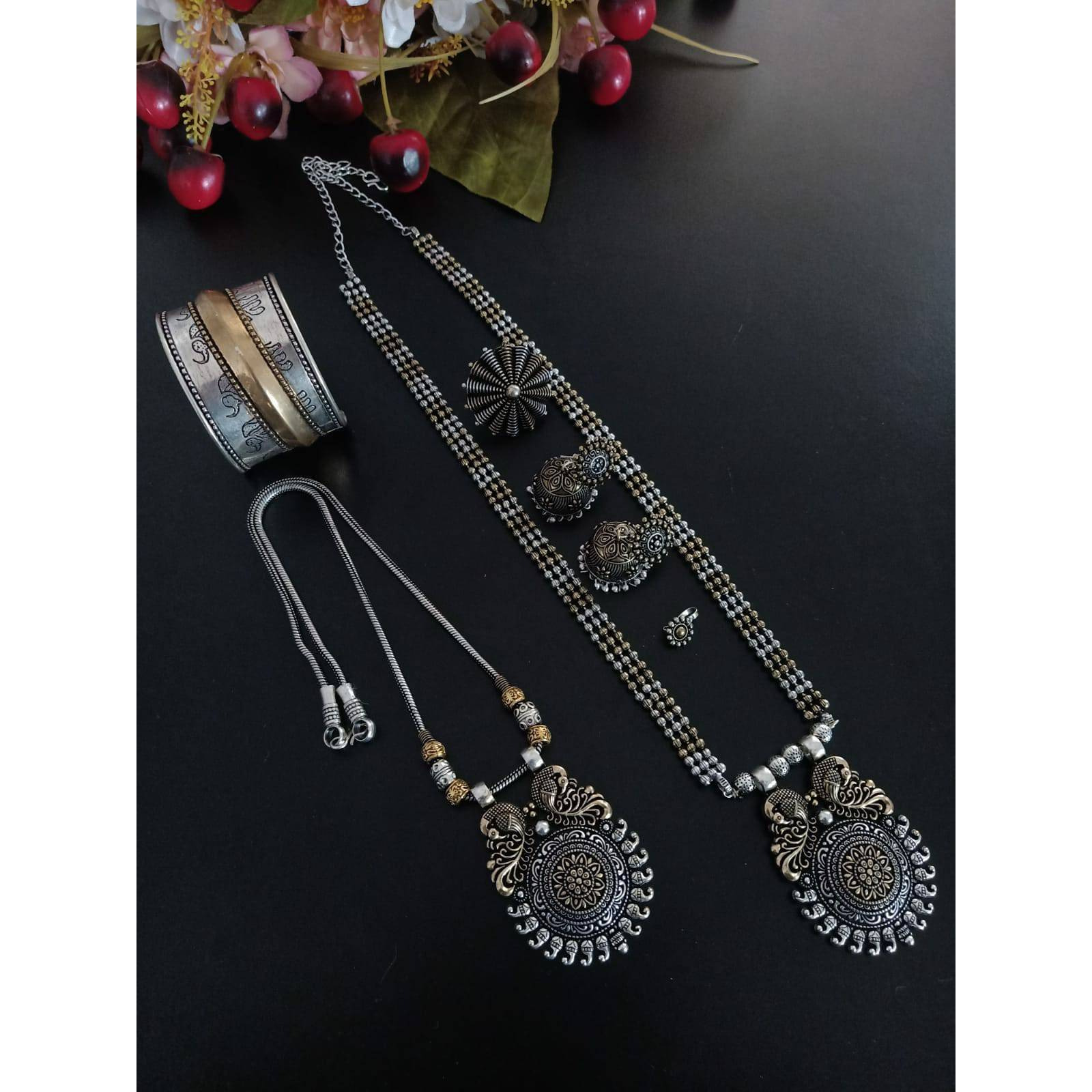 It is an oxidized Indian jewelry with a tribal look. In this pack you will get four similar looking oxidized bangles along with an oxidized ring. The bangles have ghunghroo attached with the bangles that give it a unique look. This jewelry will go perfectly with an Indian outfit. This Indian jewelry set can also be worn in parties and is also ideal for everyday use. This set will also make a perfect gift for your loved ones. You will also get an assured gift with every purchase.Care Instruction