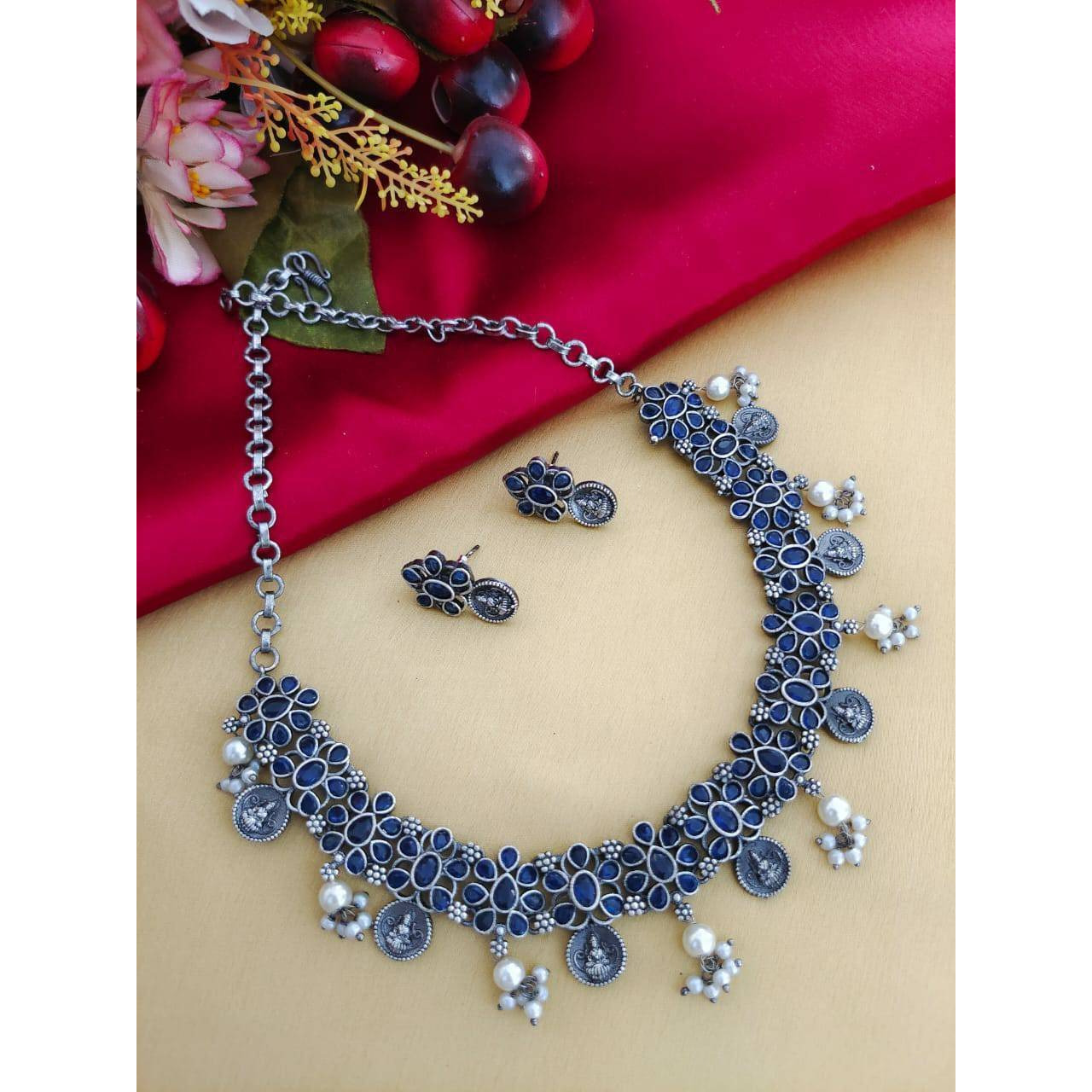MATERIAL Oxidised German silver gives a classy finish to the set. The German silver plating used when combined with the design gives a uniquely traditional look to the jewelry set. That is strong and long-lasting.OCCASION Will add lustre when worn for a wedding, engagement, party, prom and any special occasion. Will enhance special days like Valentine's day, Birthdays, Anniversaries, and Mother's Day.CARE INSTRUCTION  Avoid Heat & Chemicals Like Perfume, Deo, Alcohol, Etc