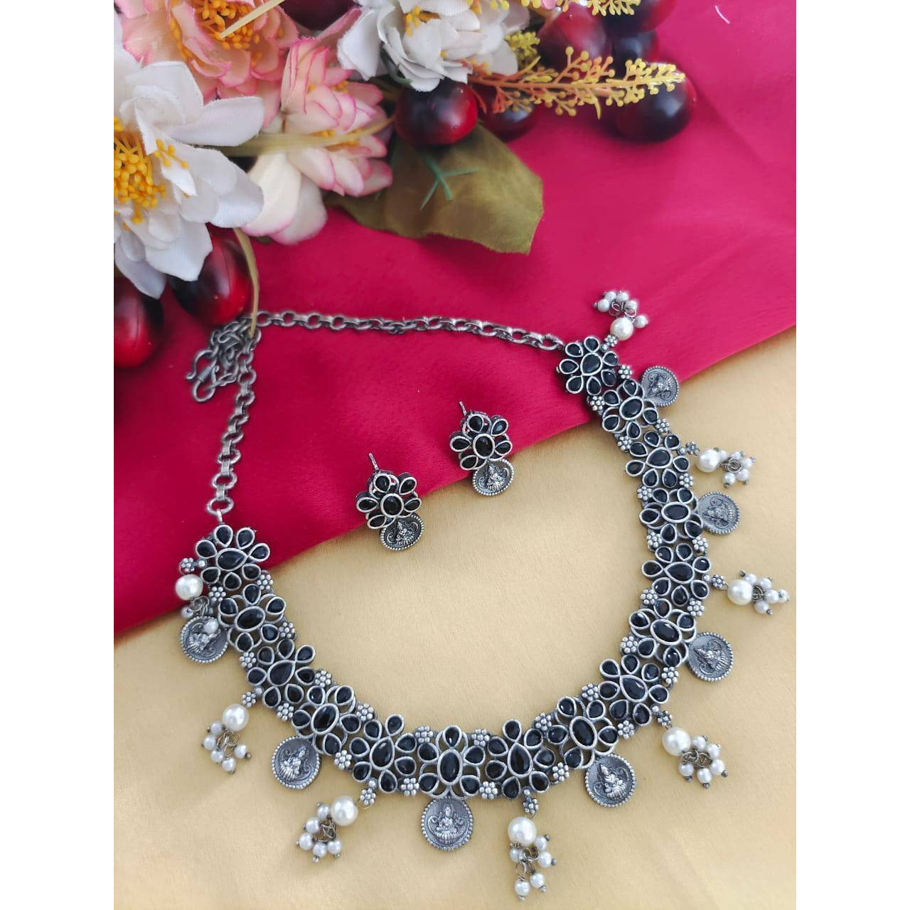 MATERIAL Oxidised German silver gives a classy finish to the set. The German silver plating used when combined with the design gives a uniquely traditional look to the jewelry set. That is strong and long-lasting.OCCASION Will add lustre when worn for a wedding, engagement, party, prom and any special occasion. Will enhance special days like Valentine's day, Birthdays, Anniversaries, and Mother's Day.CARE INSTRUCTION  Avoid Heat & Chemicals Like Perfume, Deo, Alcohol, Etc