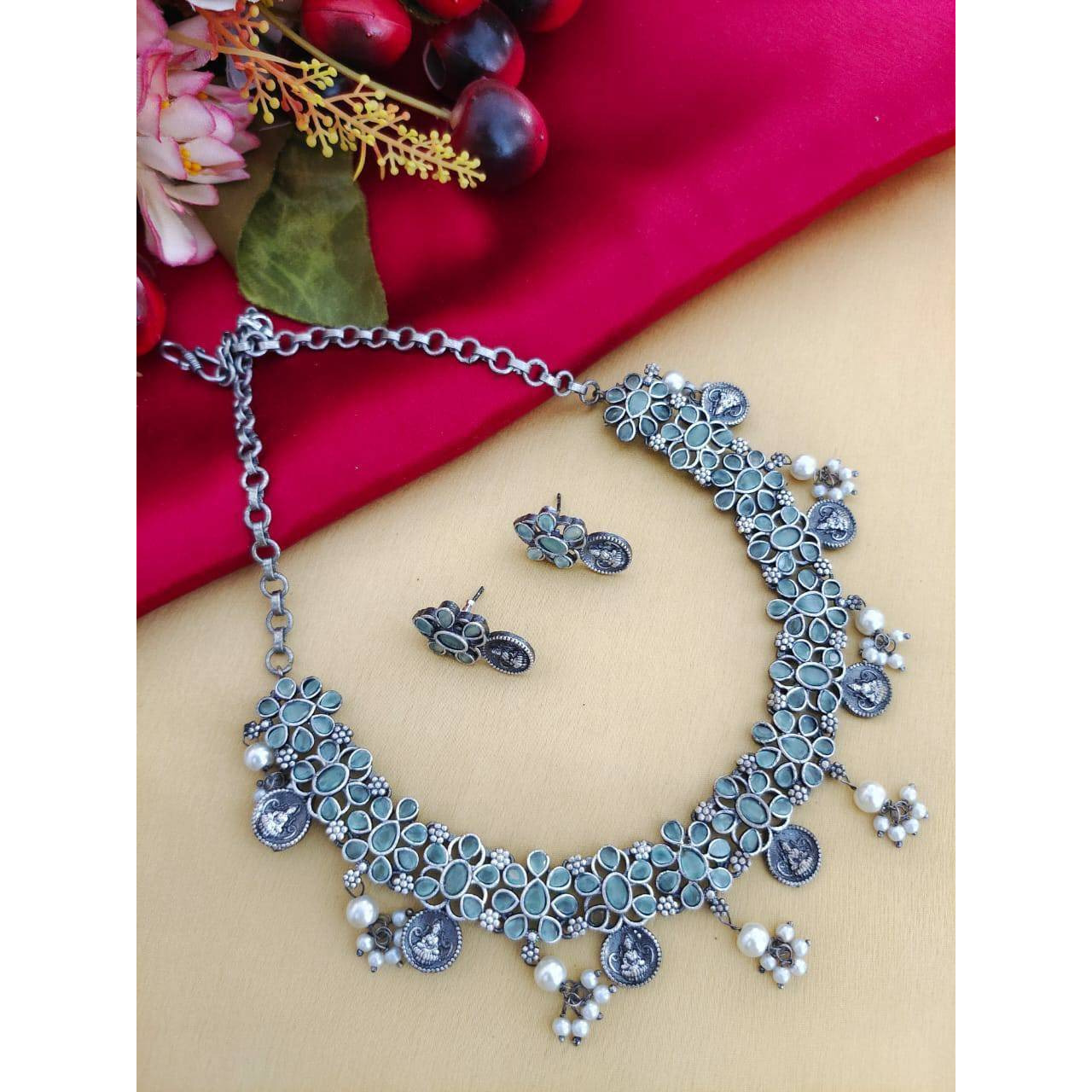 MATERIAL Oxidised German silver gives a classy finish to the set. The German silver plating used when combined with the design gives a uniquely traditional look to the jewelry set. That is strong and long-lasting.OCCASION Will add lustre when worn for a wedding, engagement, party, prom and any special occasion. Will enhance special days like Valentine's day, Birthdays, Anniversaries, and Mother's Day.CARE INSTRUCTION  Avoid Heat & Chemicals Like Perfume, Deo, Alcohol, Etc