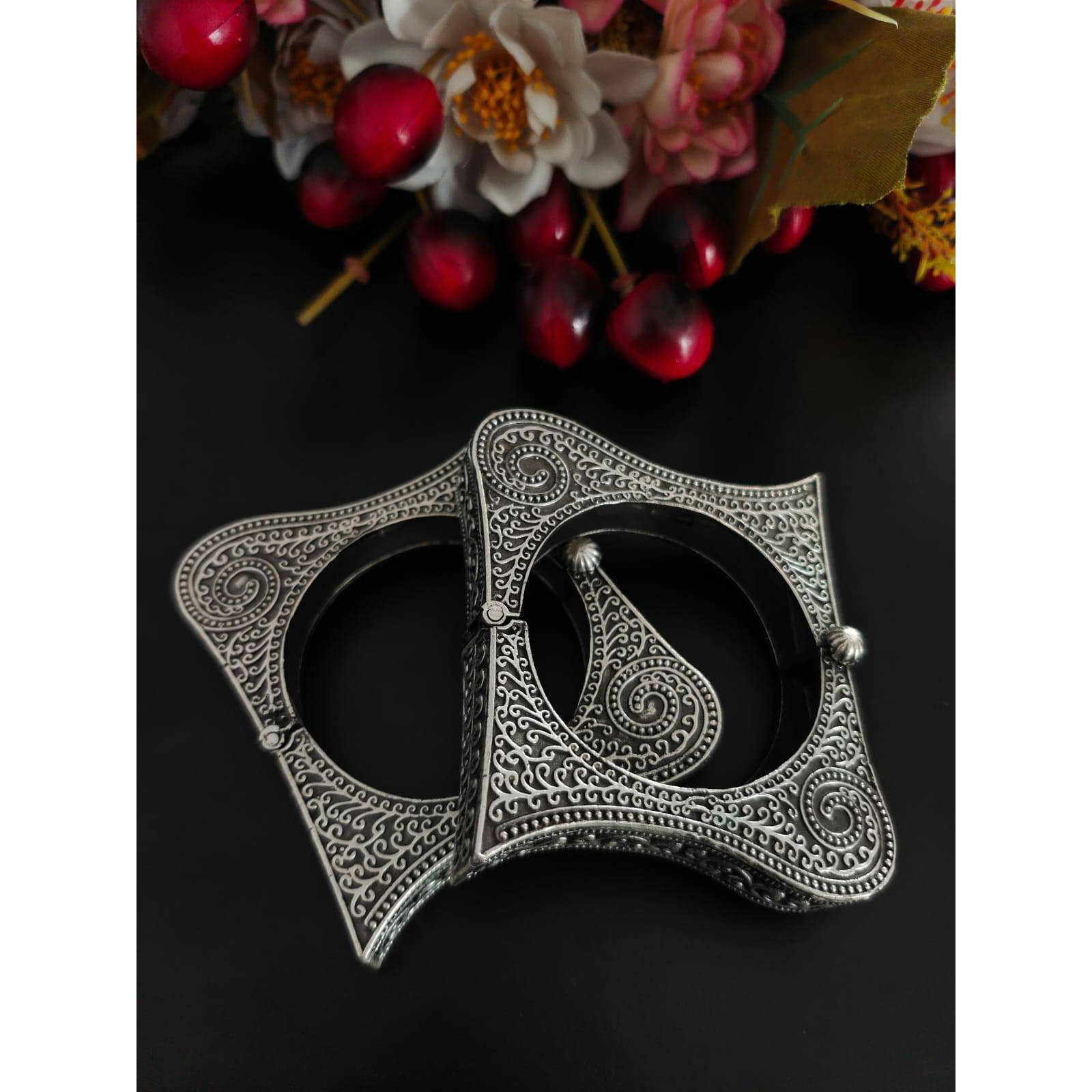 Indian oxidised bangles.Bringing you a one-of-a-kind bangle bracelet kada that celebrates geometric design in a unique way. It is crafted in german silver featuring repeating spoke patterns that will be a valuable addition to your jewel box. Playful and elegant, this bangle will be your favorite accessory for every time to dress up