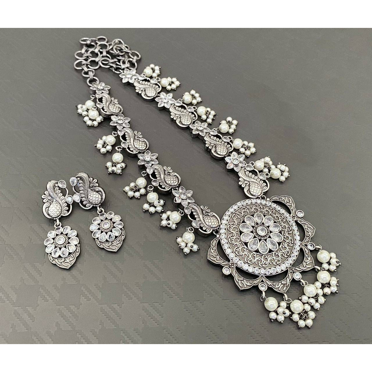 Adorn your beautiful personality with this exquisitely designed and handcrafted necklace in high quality German Silver. Pair it up with any casual,semi formal or formal attire for that traditional yet contemporary look.Premium quality