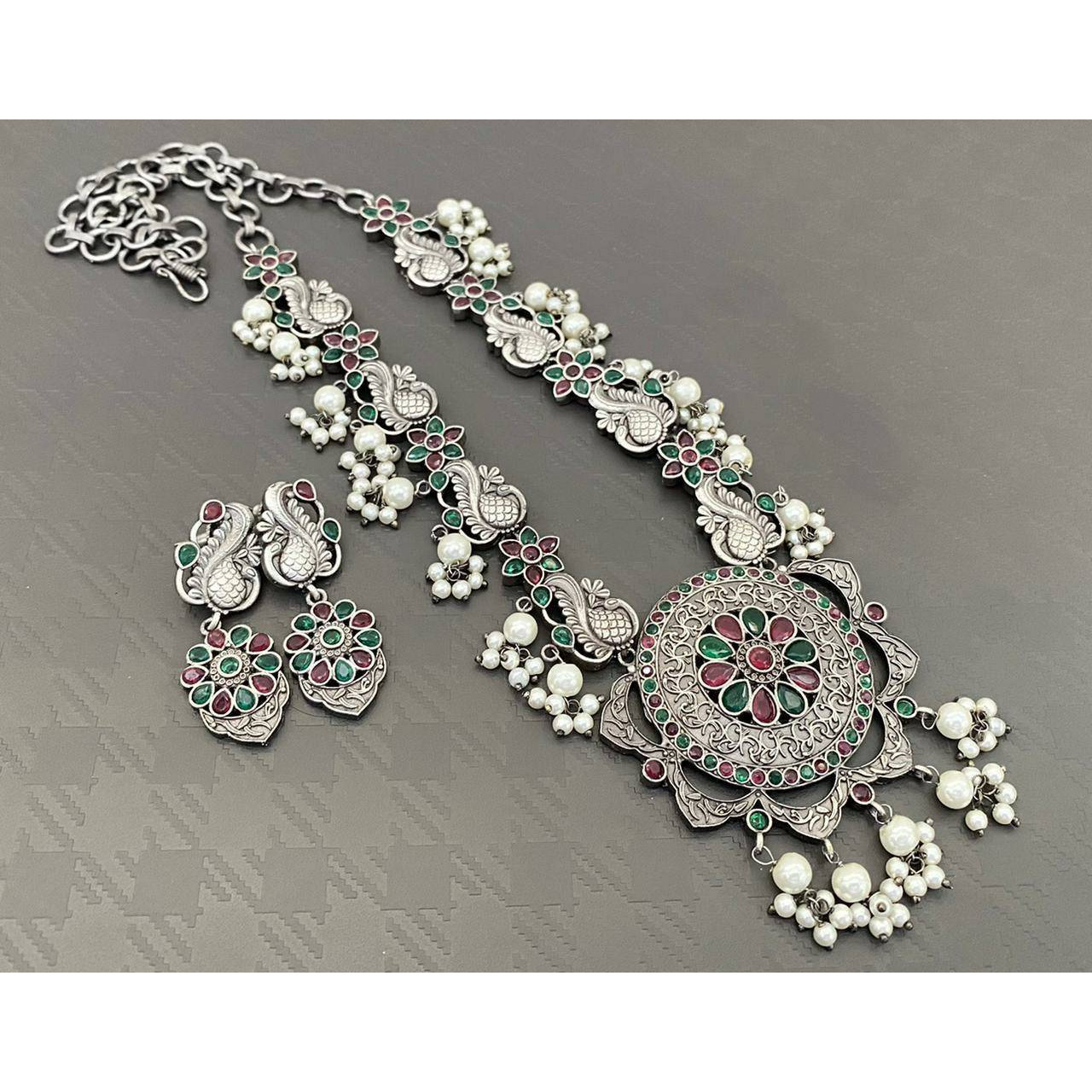 Adorn your beautiful personality with this exquisitely designed and handcrafted necklace in high quality German Silver. Pair it up with any casual,semi formal or formal attire for that traditional yet contemporary look.Premium quality