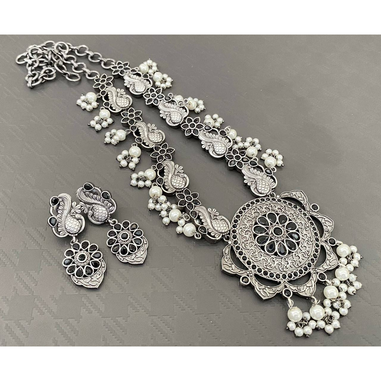 Adorn your beautiful personality with this exquisitely designed and handcrafted necklace in high quality German Silver. Pair it up with any casual,semi formal or formal attire for that traditional yet contemporary look.Premium quality