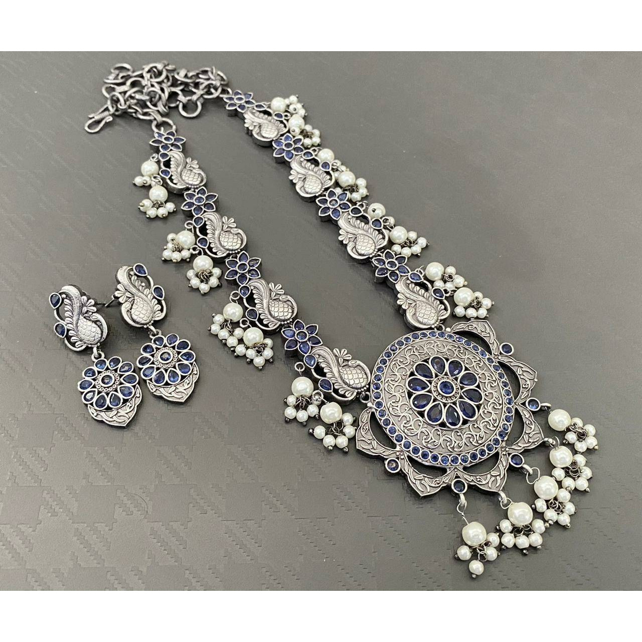 Adorn your beautiful personality with this exquisitely designed and handcrafted necklace in high quality German Silver. Pair it up with any casual,semi formal or formal attire for that traditional yet contemporary look.Premium quality