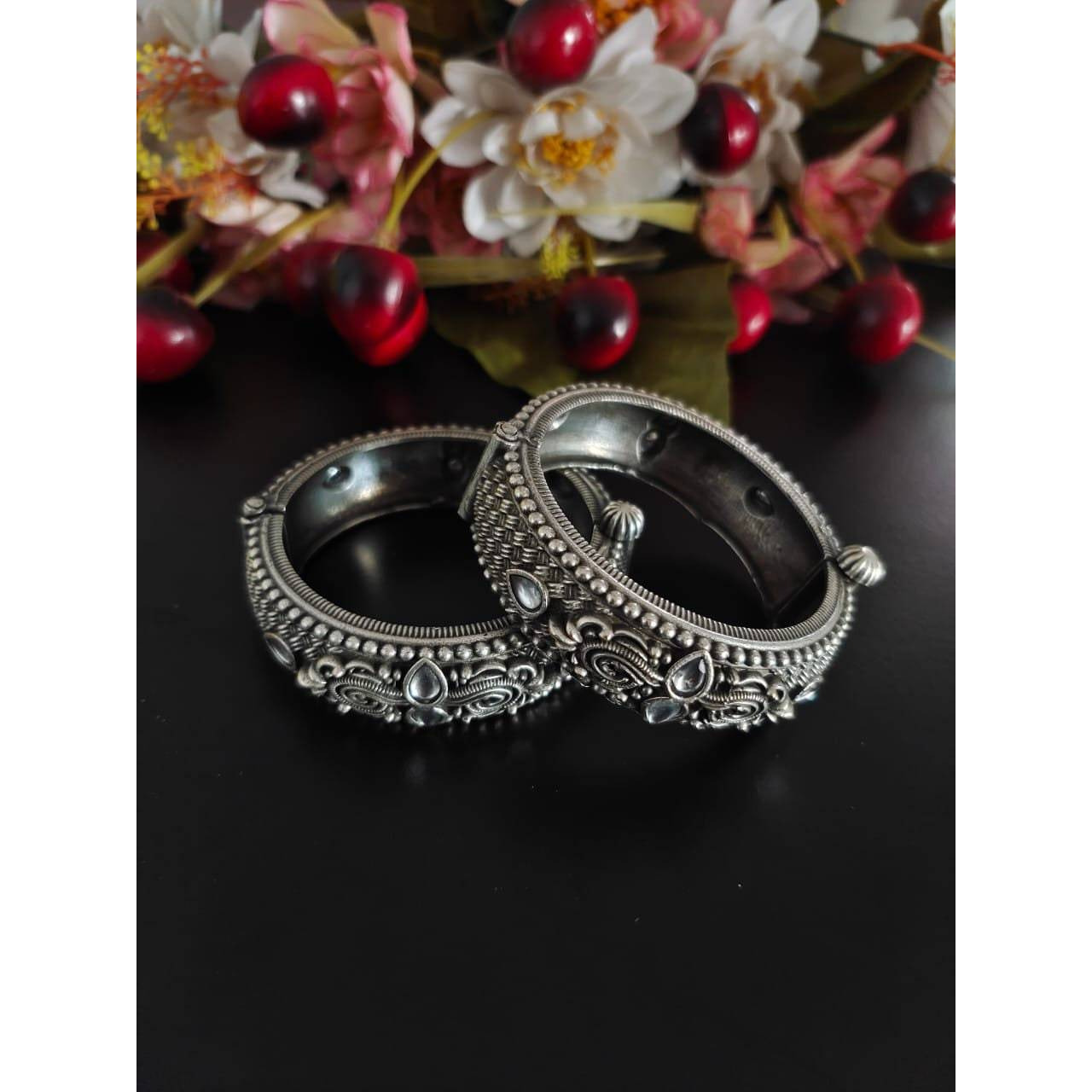 This beautiful Indian oxidized jewelry is handmade and made in india. The material used to make this jewelry is high quality brass. The package includes one handmade necklace with a beautiful peacock inspired design along with matching earrings. This German silver jewelry set has green stone embedments which makes it one of a kind. This would prove to be a treasure in your wardrobe. The best part is that you will also get an assured gift on every purchase.Care instructions keep this oxidized je