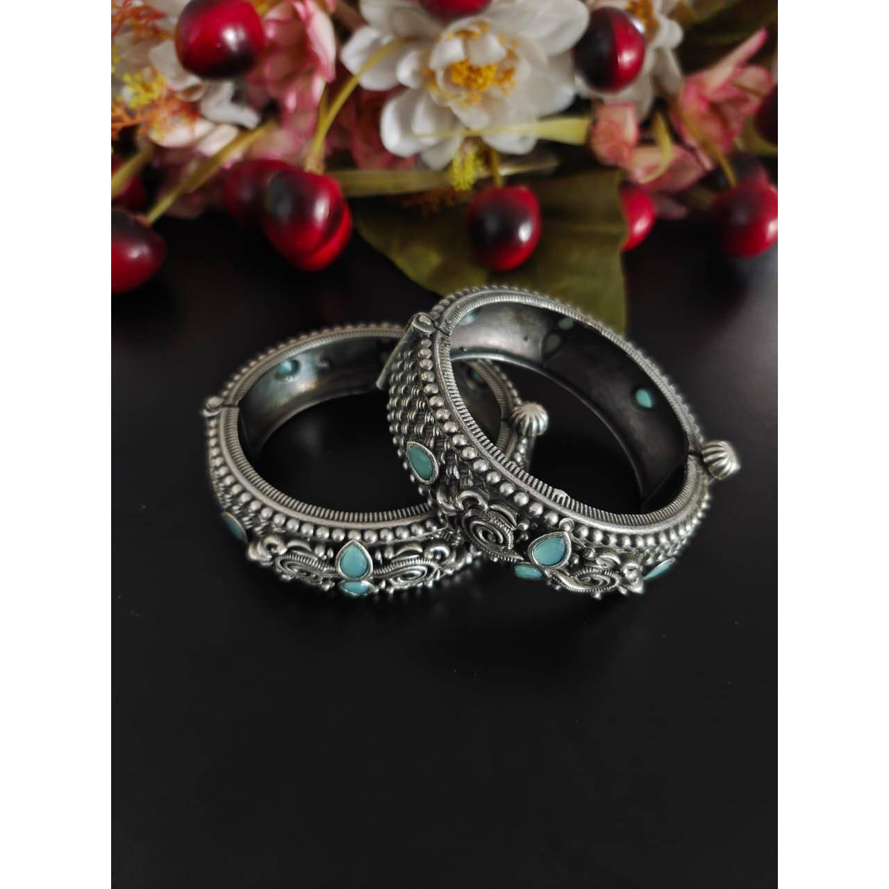 This beautiful Indian oxidized jewelry is handmade and made in india. The material used to make this jewelry is high quality brass. The package includes one handmade necklace with a beautiful peacock inspired design along with matching earrings. This German silver jewelry set has green stone embedments which makes it one of a kind. This would prove to be a treasure in your wardrobe. The best part is that you will also get an assured gift on every purchase.Care instructions keep this oxidized je