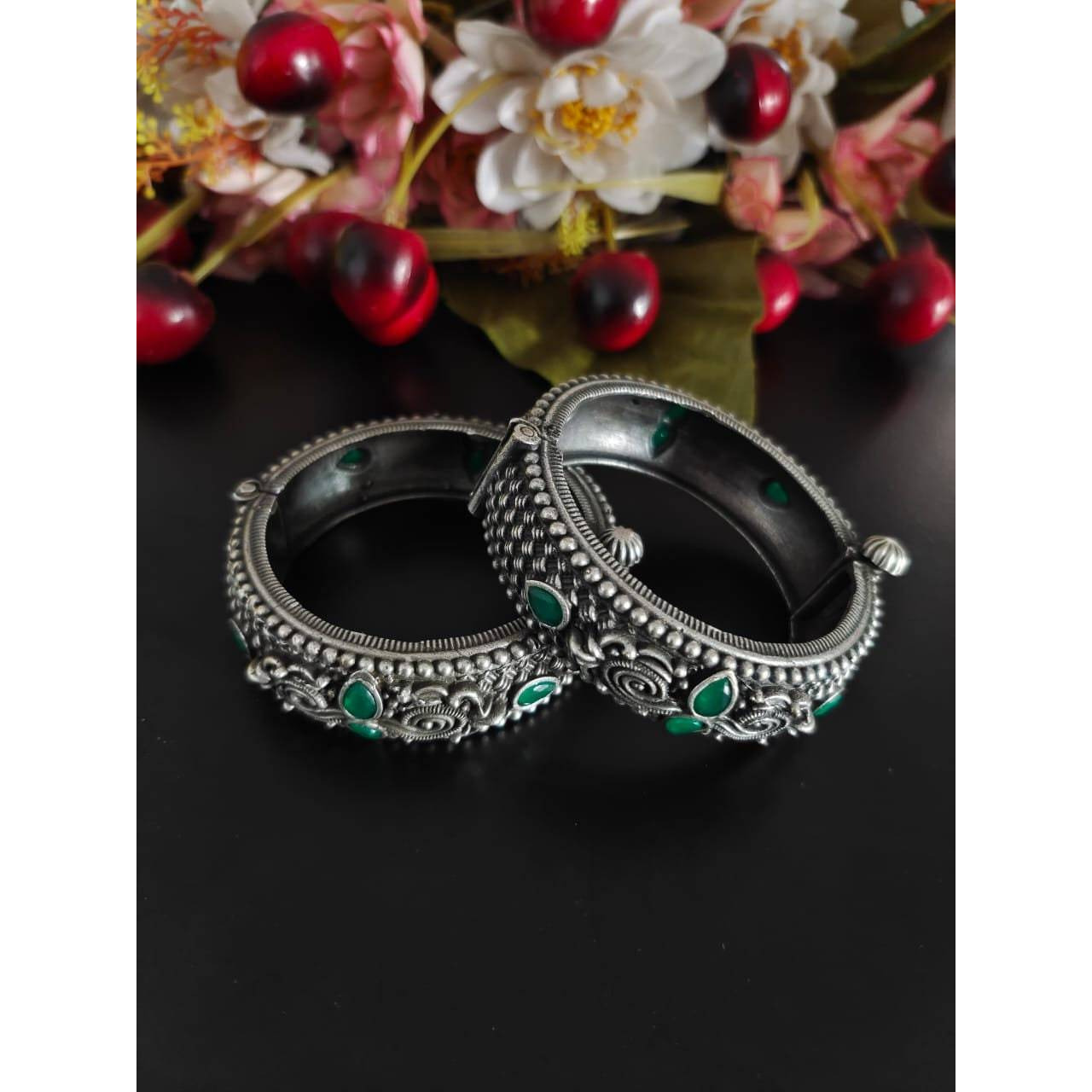 This beautiful Indian oxidized jewelry is handmade and made in india. The material used to make this jewelry is high quality brass. The package includes one handmade necklace with a beautiful peacock inspired design along with matching earrings. This German silver jewelry set has green stone embedments which makes it one of a kind. This would prove to be a treasure in your wardrobe. The best part is that you will also get an assured gift on every purchase.Care instructions keep this oxidized je