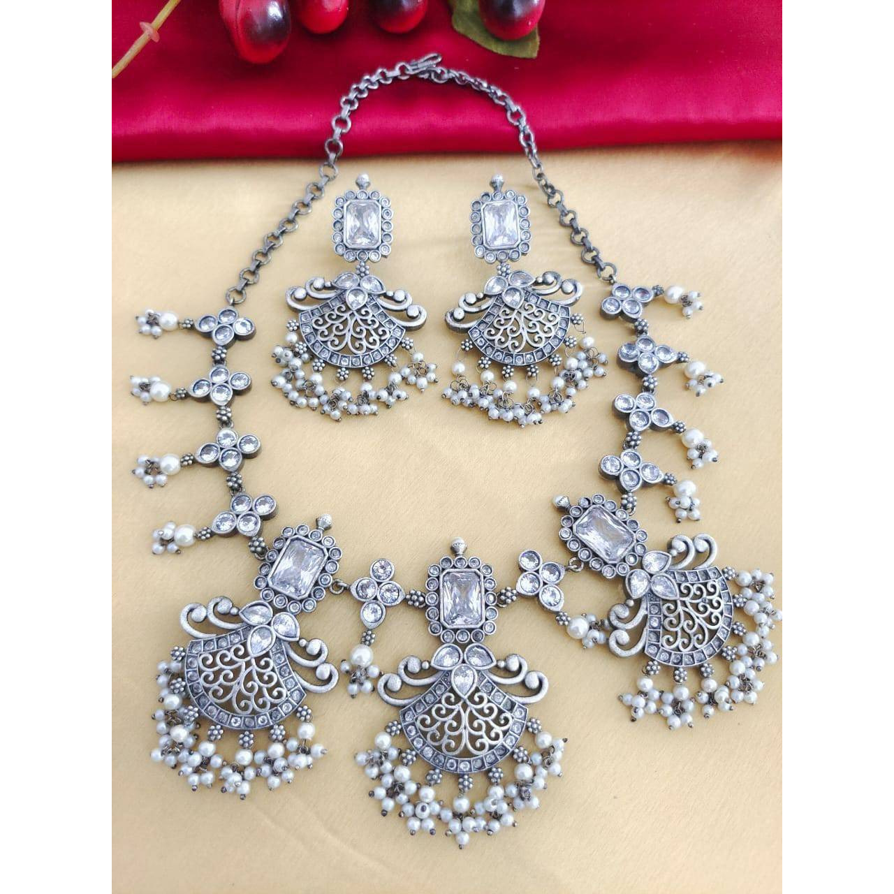 Adorn your wrist with a beautiful chime. This bracelet and ring adds a perfect amount of pretty you would like to add to your ethnic outfits. This Ghungroo bracelet kada and peacock Ring is crafted in German silver and shiny bells that create a melody of charm and beauty. An accessory that will complete your look with minimum effort and maximum style quotient