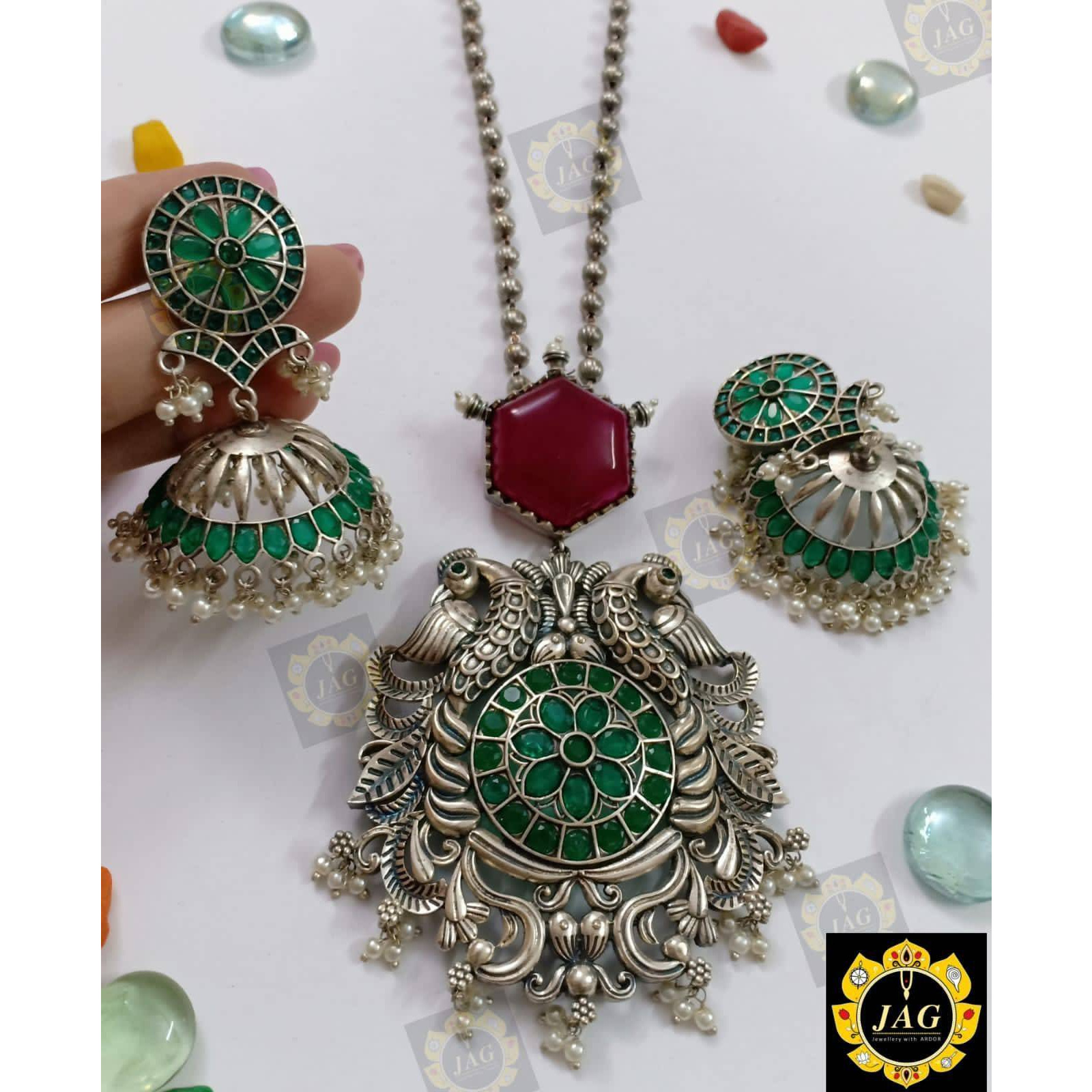 Keep your look simple yet stylish by wearing this graceful piece by Vastrabhushan. Mirror white glass in this earring are handcrafted in oxidised silver  and also boasts of intricate design and a charming finesse. Pair it with a white rib-cage, raglan sleeves top and boot-cut high rise denim pants, finish off the look with cat heels.