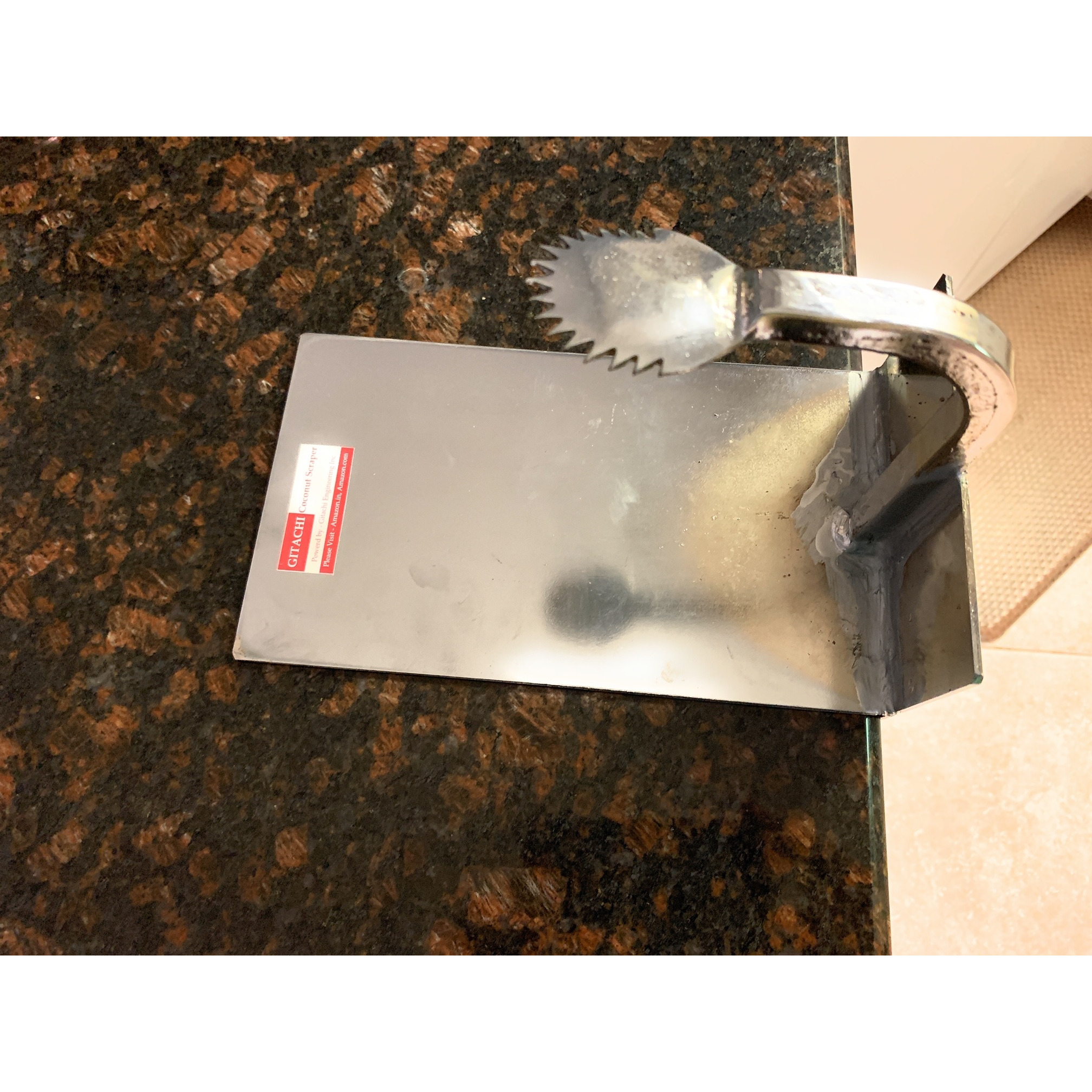 Table top coconut hand scraper