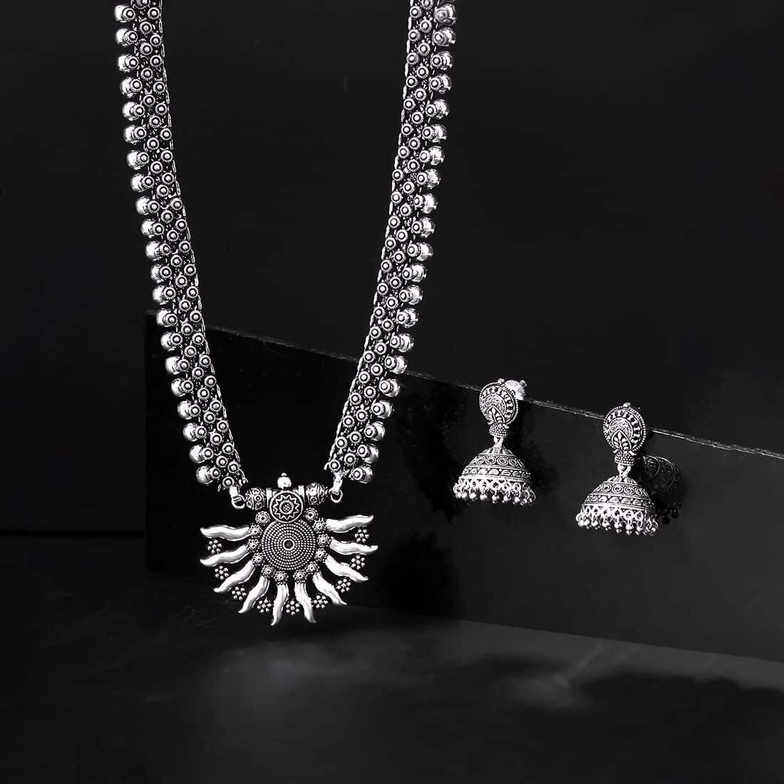Yellow Chimes German Silver Oxidized Designer Traditional Long Pendant Necklace with Jhumka Earrings by Yellow Chimes Jewellery Set for Women (Oxidized Silver) (YCTJNS-29OXDSUN-SL)