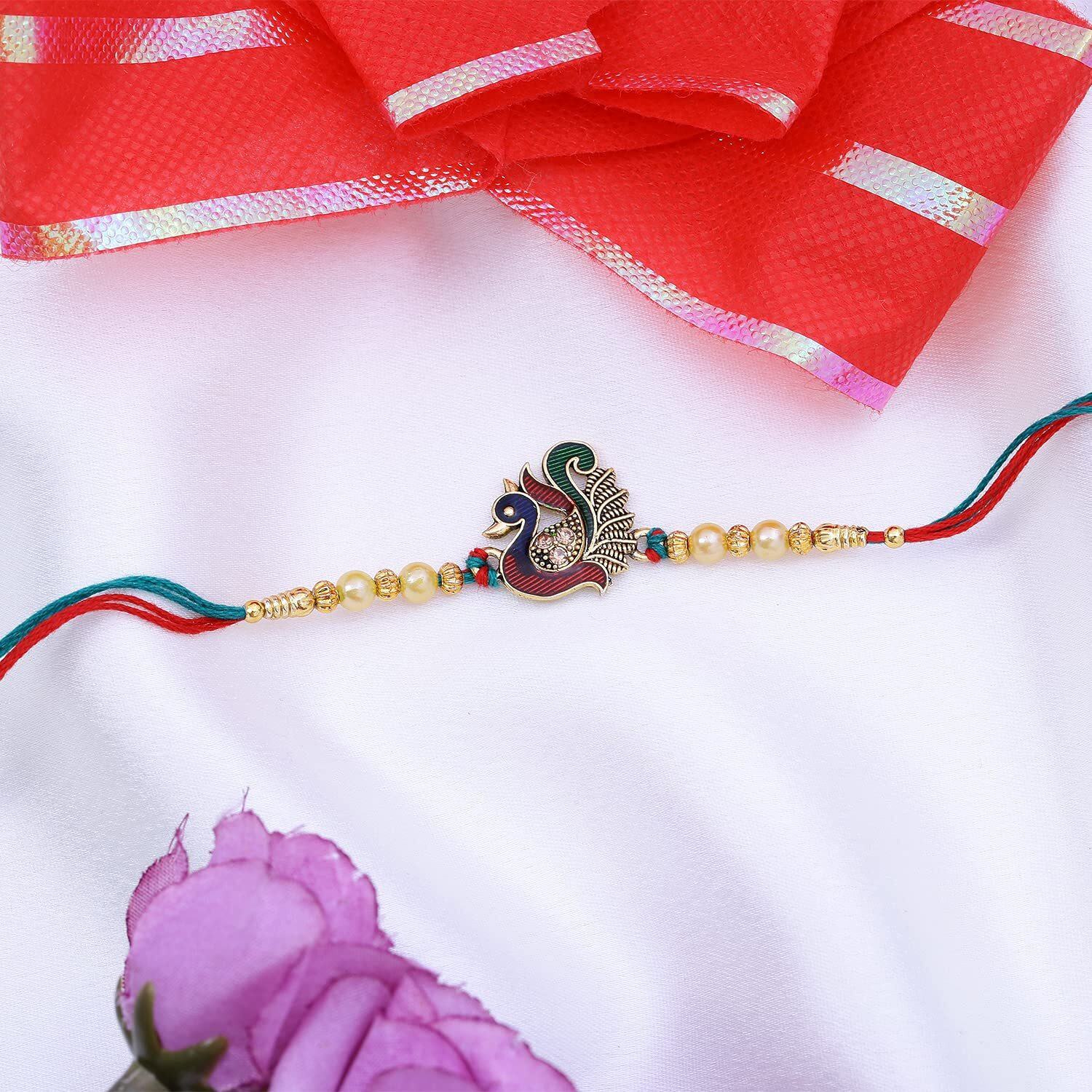 Riddhika Ventures Stunning Gold Plated Designer Peacock and Auspicious kalash Rakhi with Roli Chawal and Greeting Card (P7)