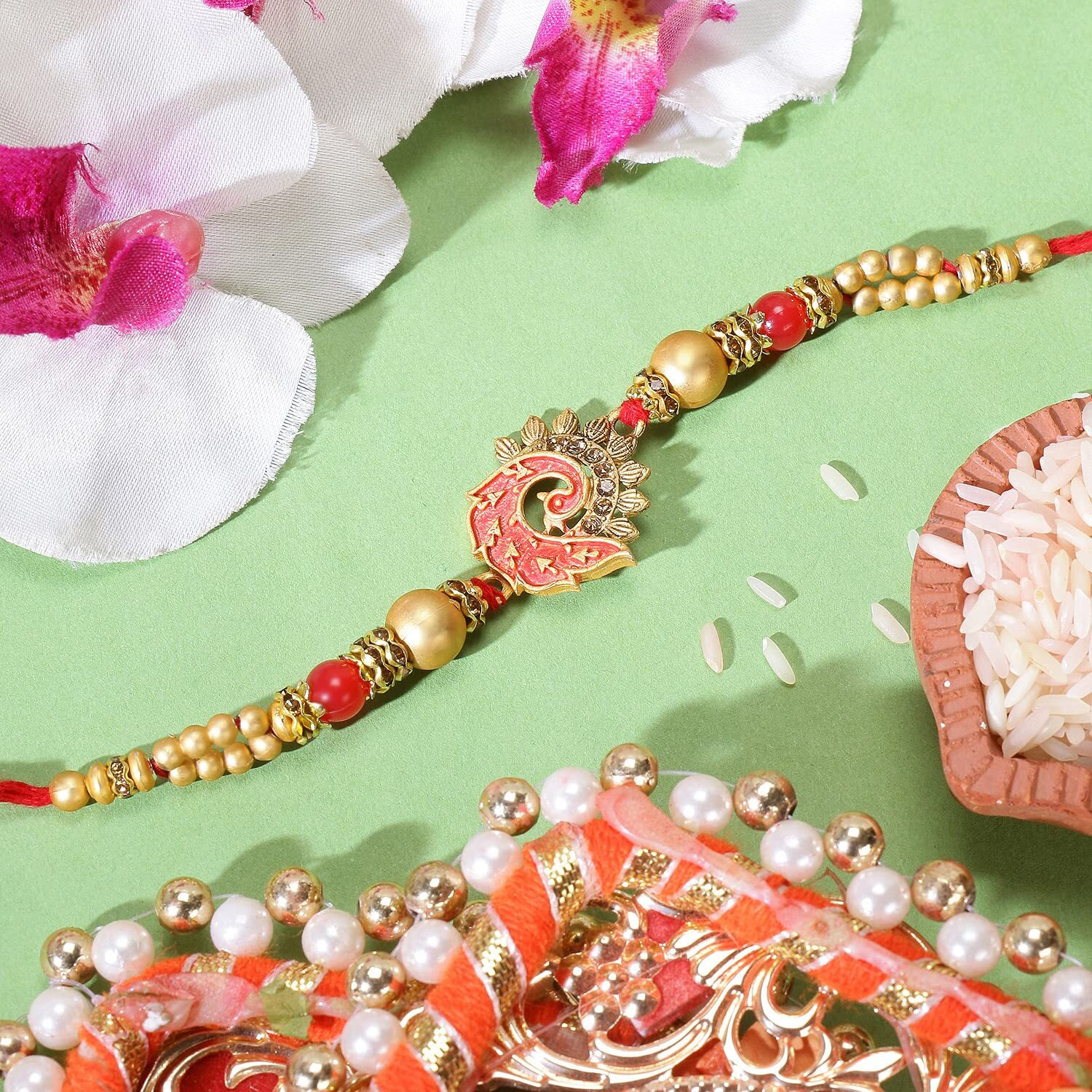 Riddhika Ventures Stylish Peacock Feather and Kundan Rakhi with Roli Chawal and Greeting Card (K4)