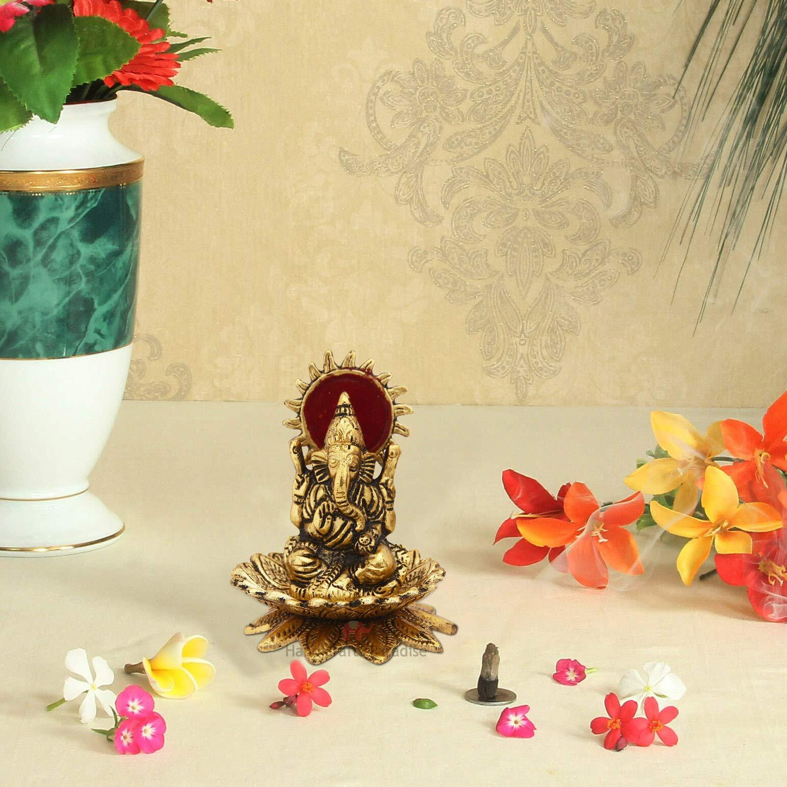 Handicrafts Paradise Metal Lord Ganesh Seated On A Flower with A Halo Carved in Antique Golden Finish Showpiece 4.25 Inches