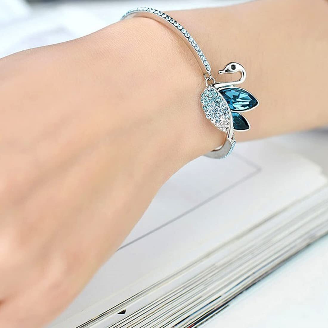 Yellow Chimes Swan Designer by Yellow Chimes Silver Plated and Cubic Zirconia Charm Bracelet for Women (Blue)(YCFJBR 350SWAN BL)