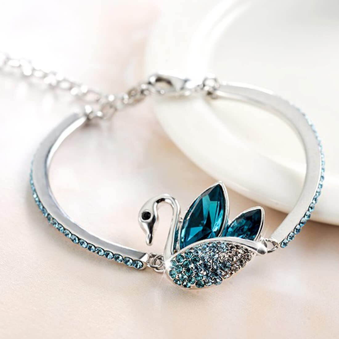Yellow Chimes Swan Designer by Yellow Chimes Silver Plated and Cubic Zirconia Charm Bracelet for Women (Blue)(YCFJBR 350SWAN BL)
