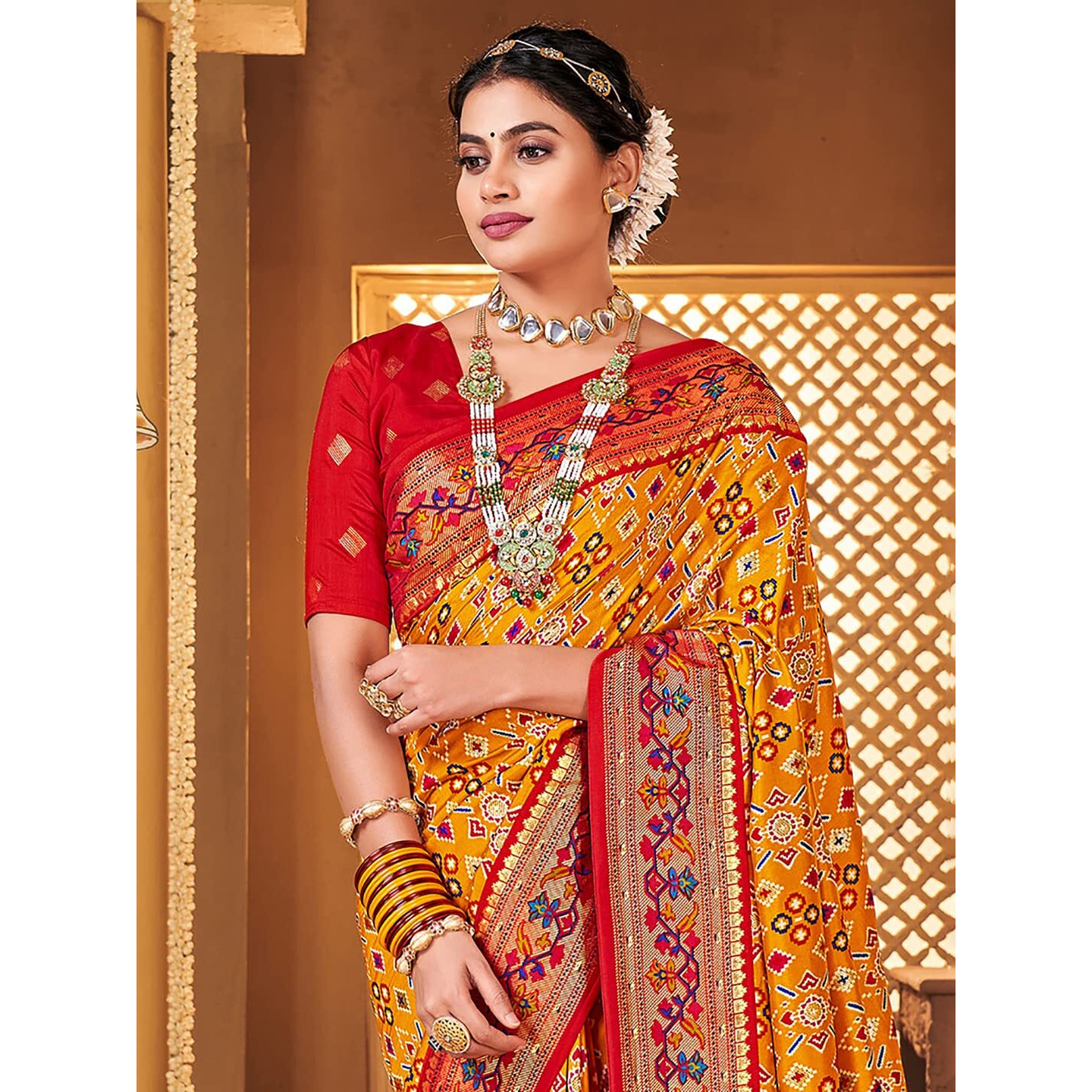 AKHILAM Womens Soft Patola Silk Ikat Print Golden Zari Border Saree With Unstitched Blouse Piece (Mustard_SMNGLM1009_SS)