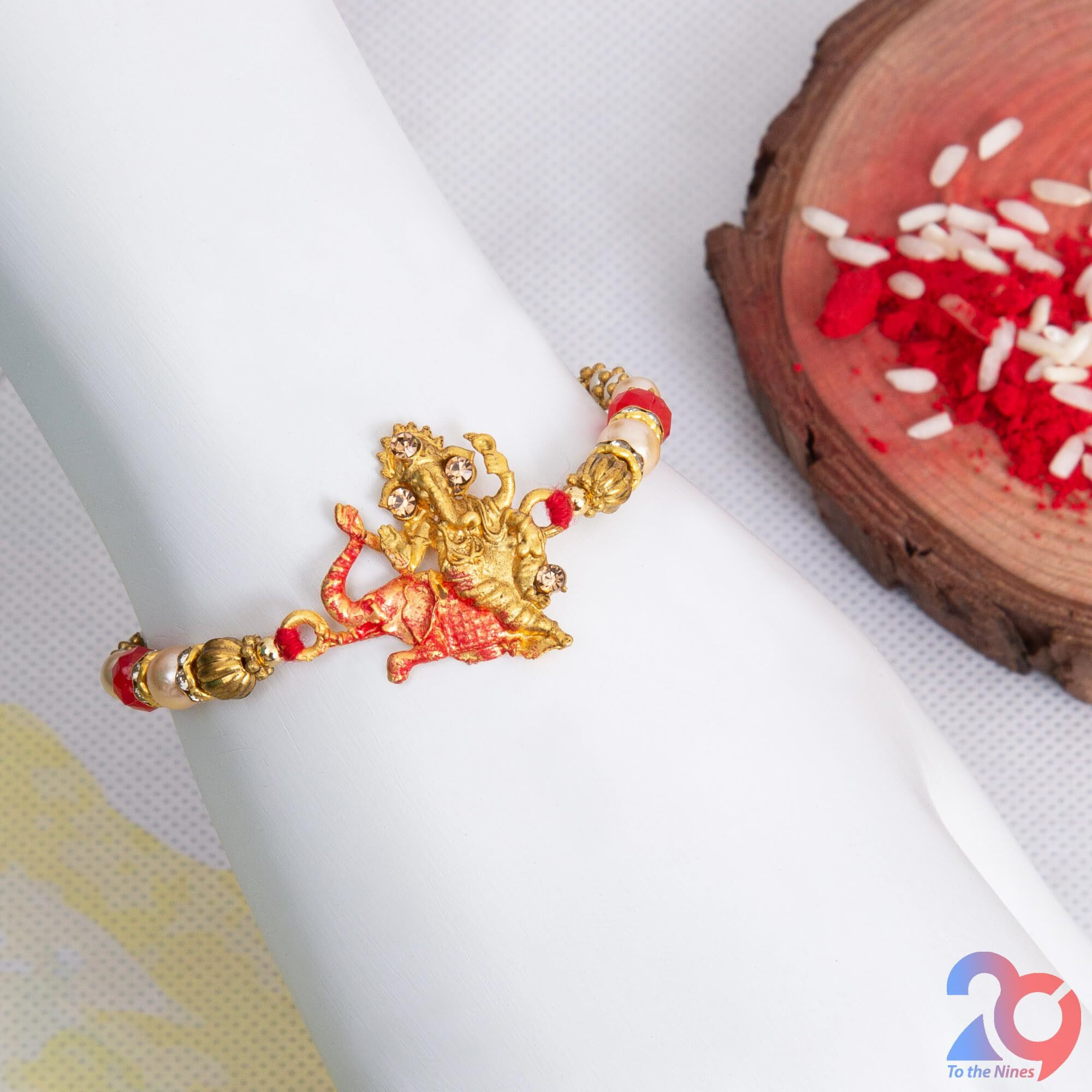 To The Nines Elegant Ganesha Red Rakhi for Beloved Brother with Tilak Material