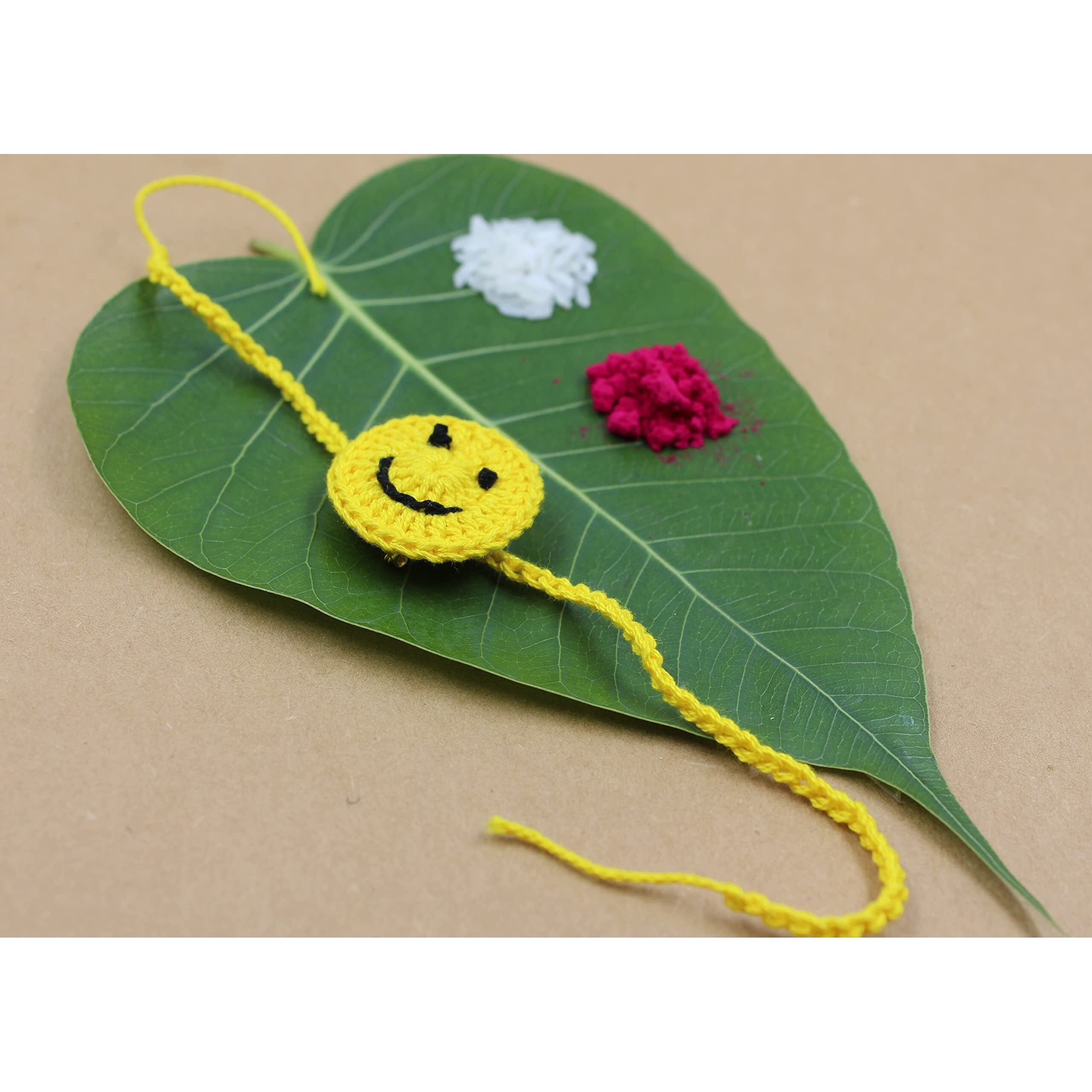 Prapti Handicrafts Handmade Embroidery Crochet Rakhi for Bhai/Bhabhi with Roli Chawal (smily pack of 2)