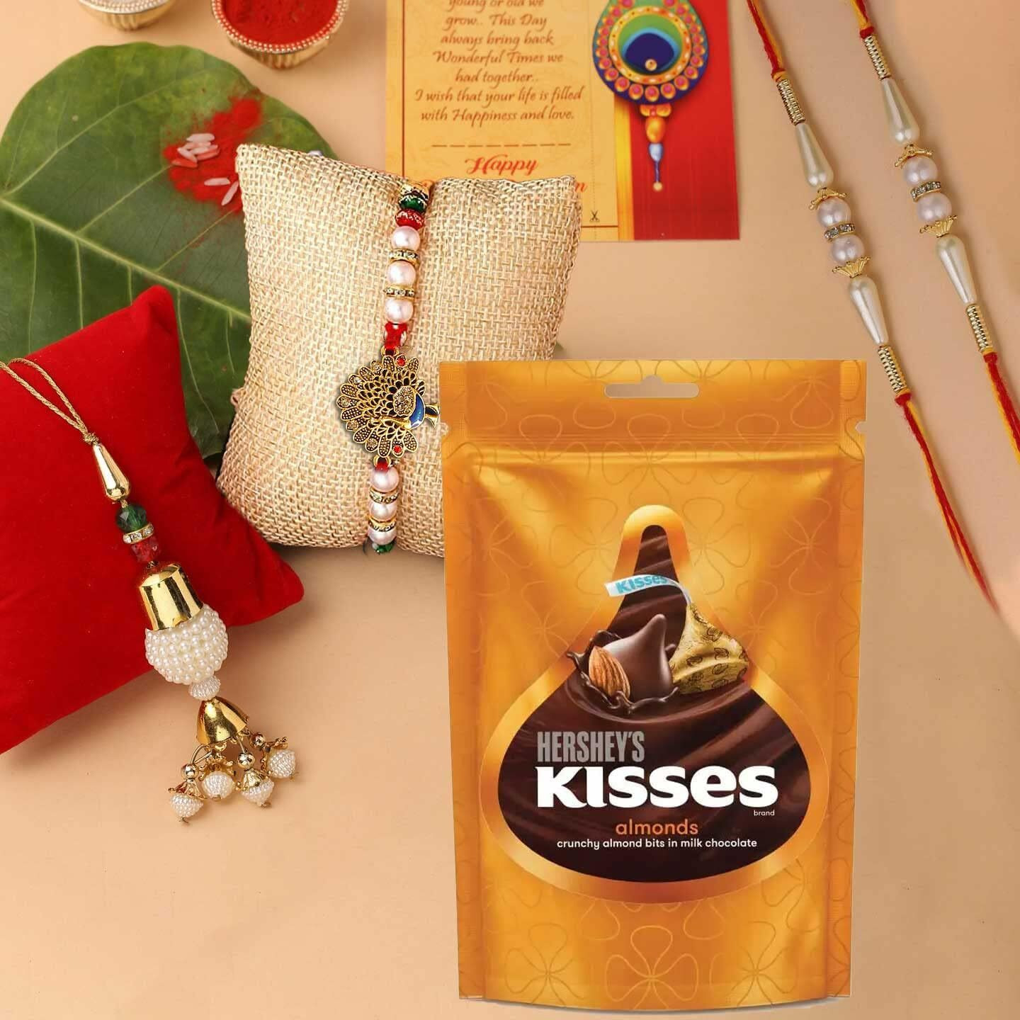 CraftVatika Rakhi Chocolate Gift Combo, Rakhi Set of 4 for Brother and Bhabhi Kids, Hersheys Kisses Chocolate with Peacock Lumba Pearl Rakhi for Bhaiya Bhabhi on Rakshabandhan
