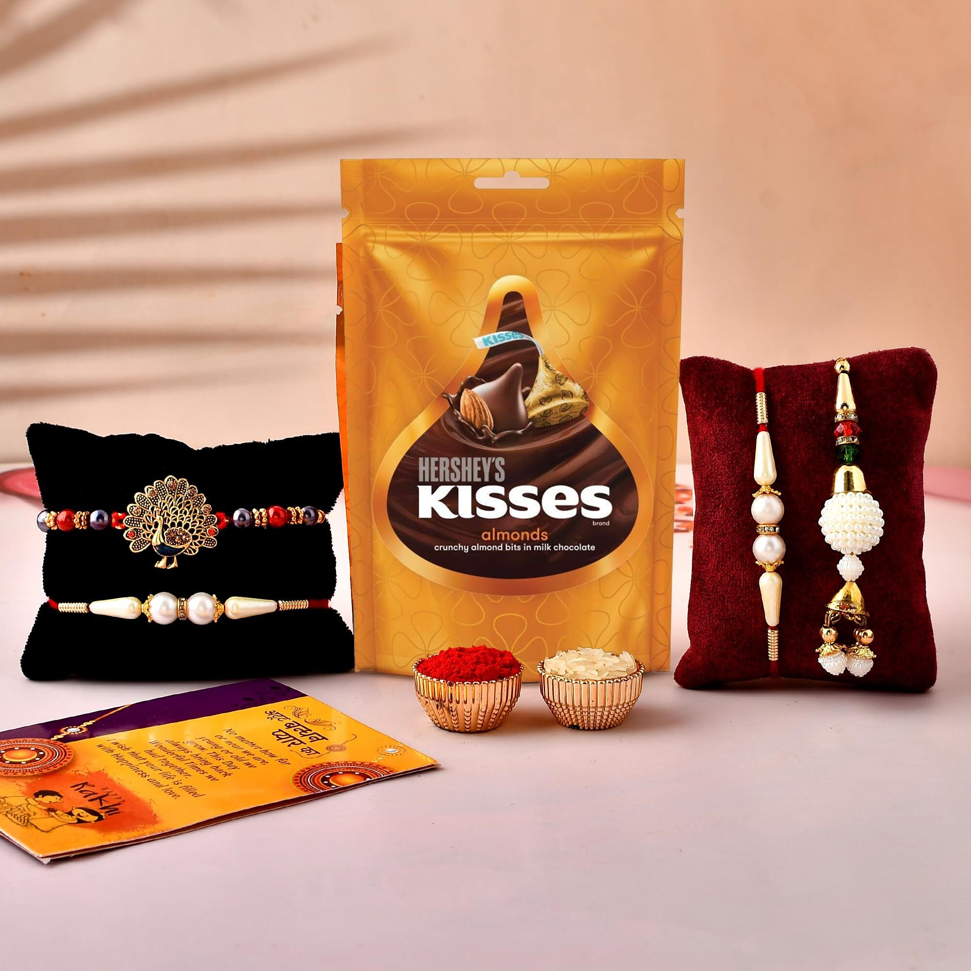 CraftVatika Rakhi Chocolate Gift Combo, Rakhi Set of 4 for Brother and Bhabhi Kids, Hersheys Kisses Chocolate with Peacock Lumba Pearl Rakhi for Bhaiya Bhabhi on Rakshabandhan