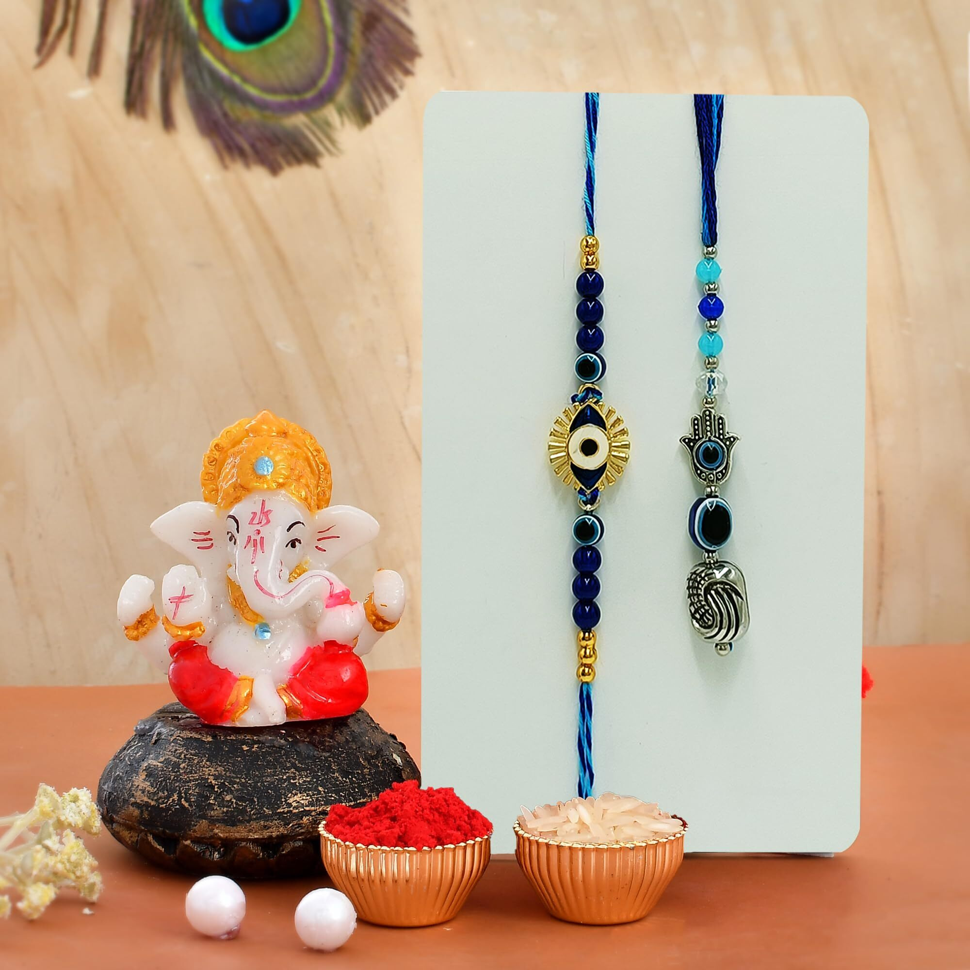 CraftVatika Rakhi Gift for Brother Bhabhi with Ganesha Showpiece Combo Gift- Evil Eye Rakhi, Designer Rakhi for Brother Bhabhi with Figurine