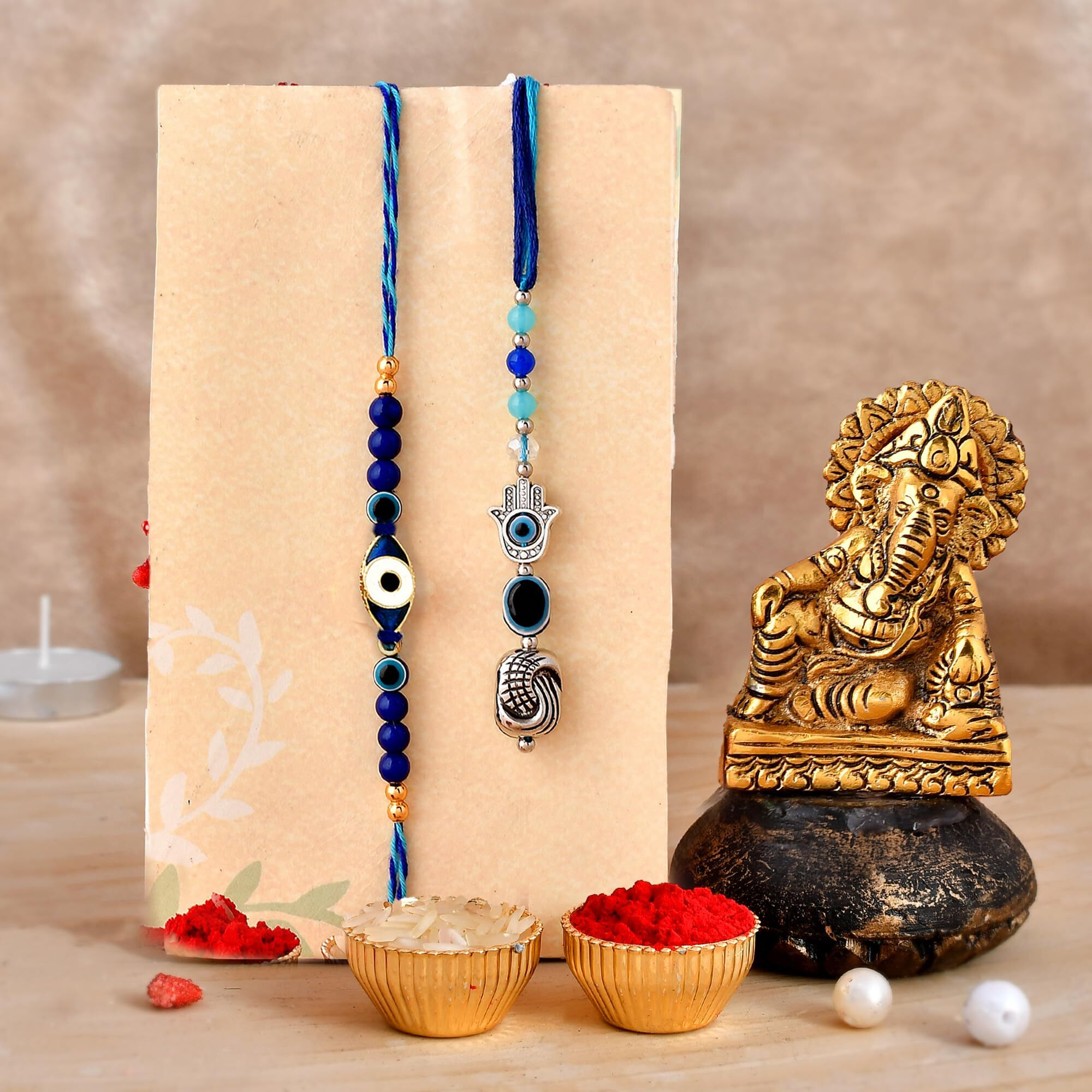CraftVatika Evil Eye Rakhi for Brother and Bhabhi Ganesha Gift Combo Rakhi with Ganesha Idol Showpiece Evil Eye Rakhi Couple Pair for Bhaiya Bhabhi Rakhis for Rakshabandhan