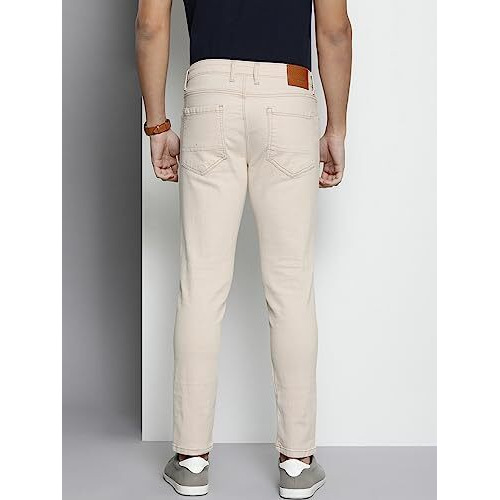 The Indian Garage Co Men Carrot Fit Solid Mid Rise Stretchable Jeans Off-White, 32