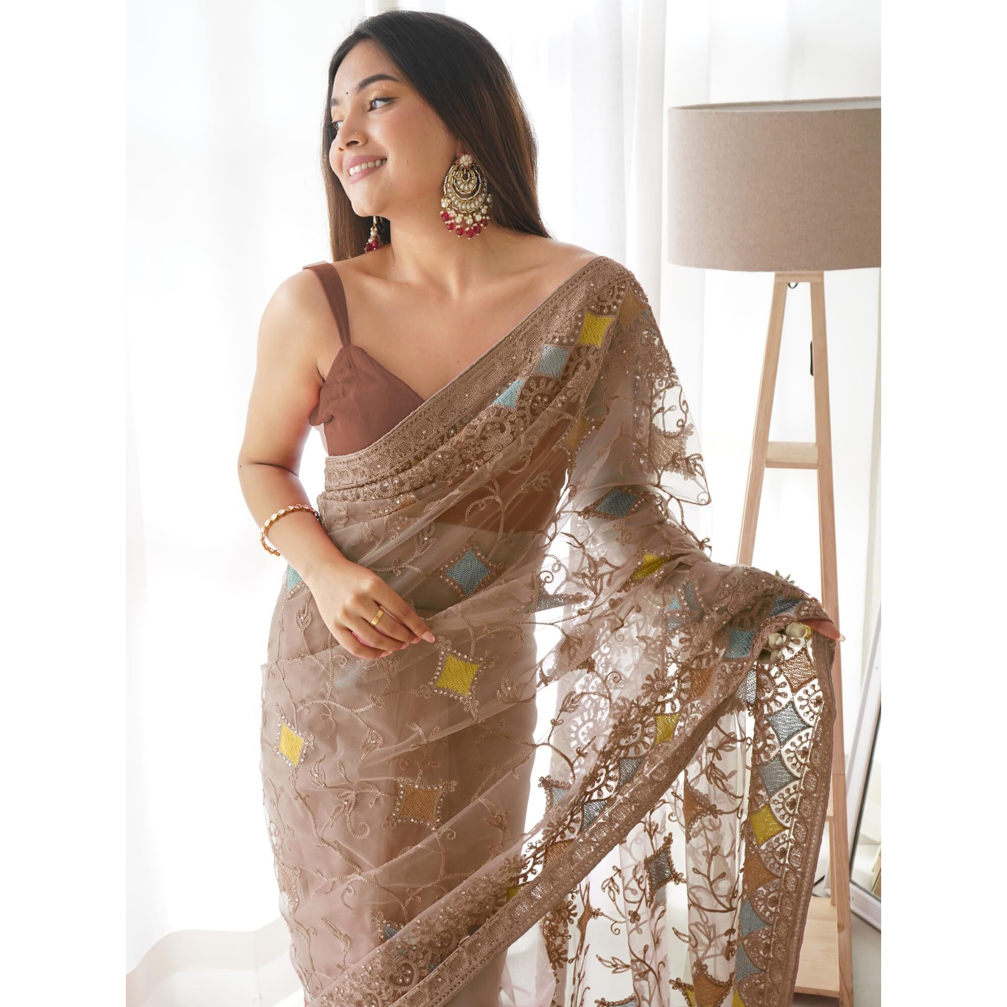 SAREE MALL Womens Net Embroidered Embellished Saree With Unstitched Blouse Piece(Brown_AAVYA702_SM)