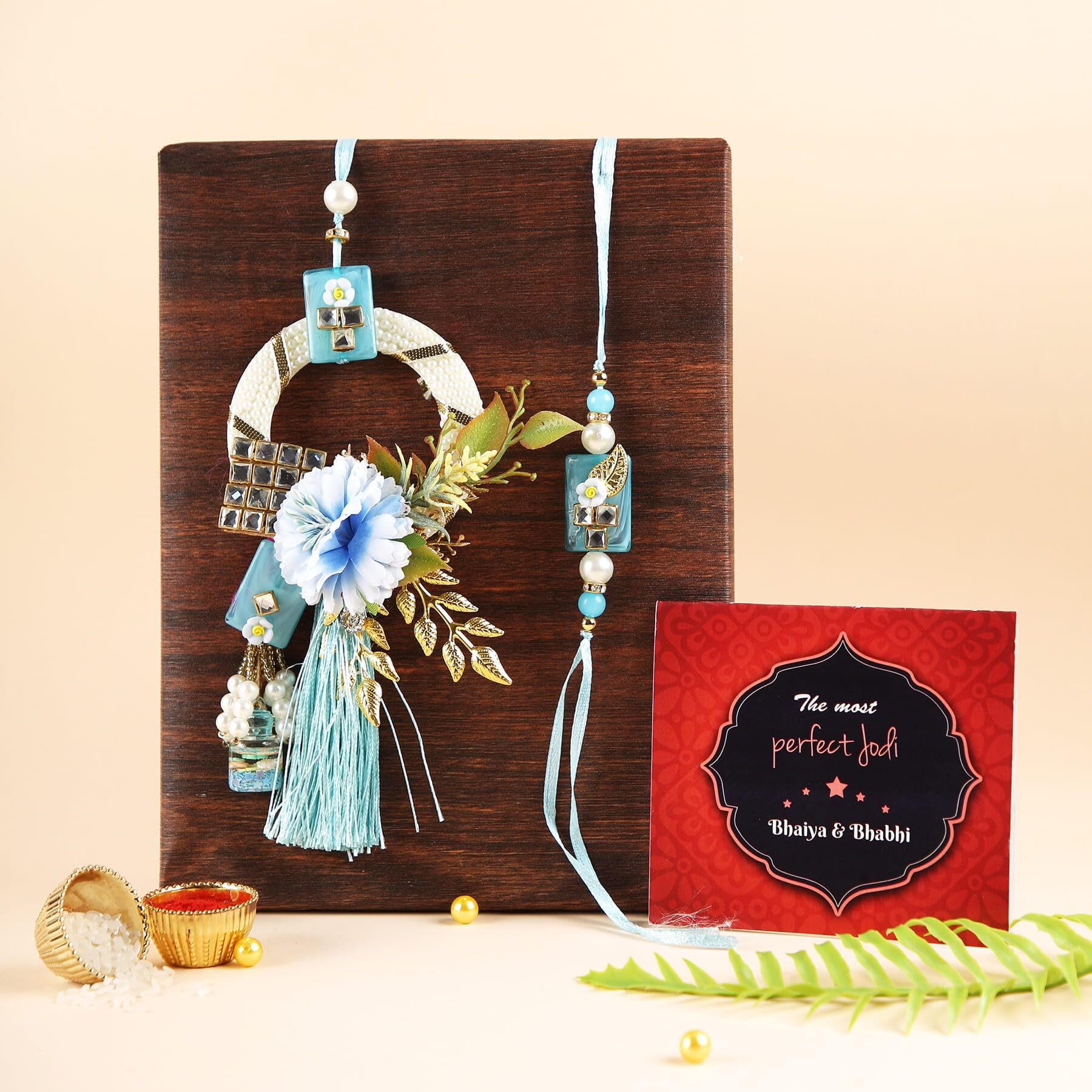 TIED RIBBONS Rakhi for Brother and Bhabhi - Premium Floral Couple Rakhi Set of 2 with Greeting Card and Tikka - Hanging Lumba Rakhi for Bhaiya Bhabhi - Rakhi for Rakshabandhan