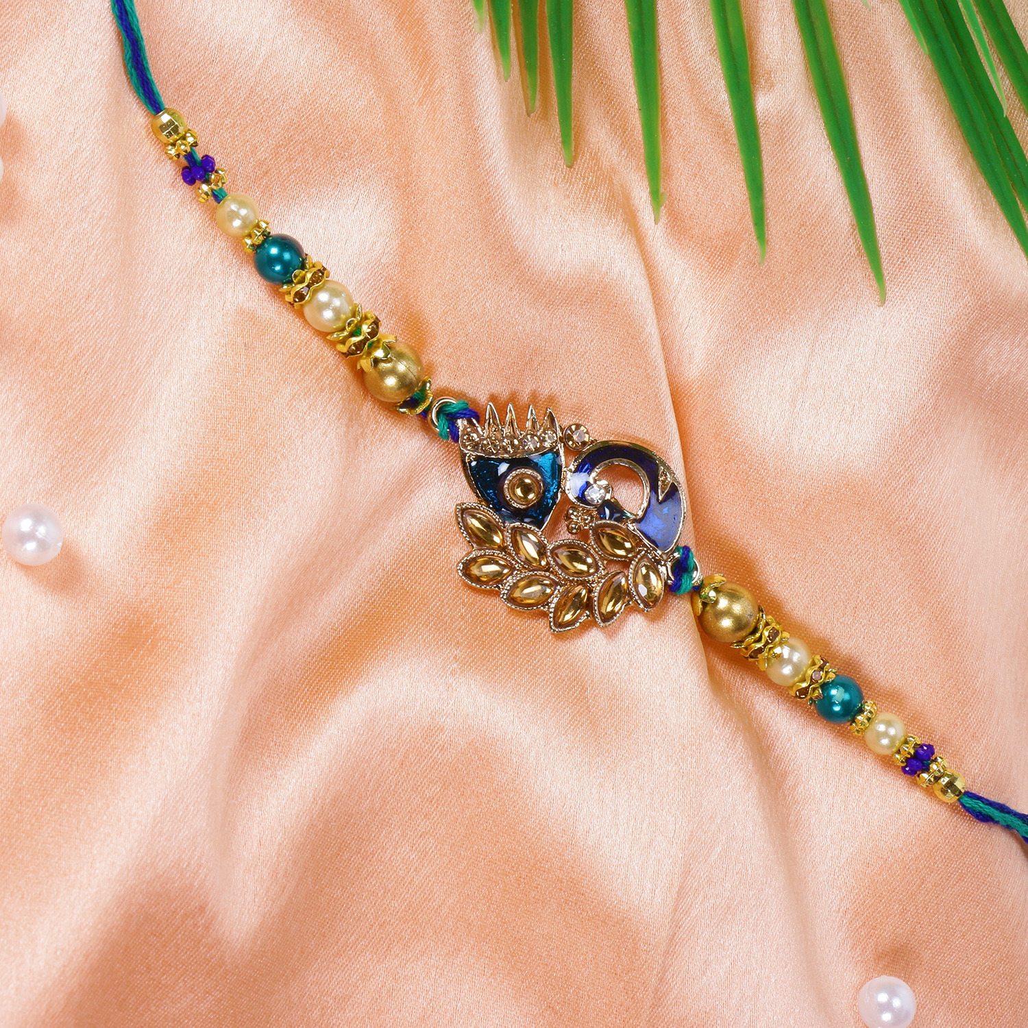 Riddhika Ventures Stylish Peacock Feather and Kundan Rakhi Bracelet with Roli Chawal and Greeting Card (K2)