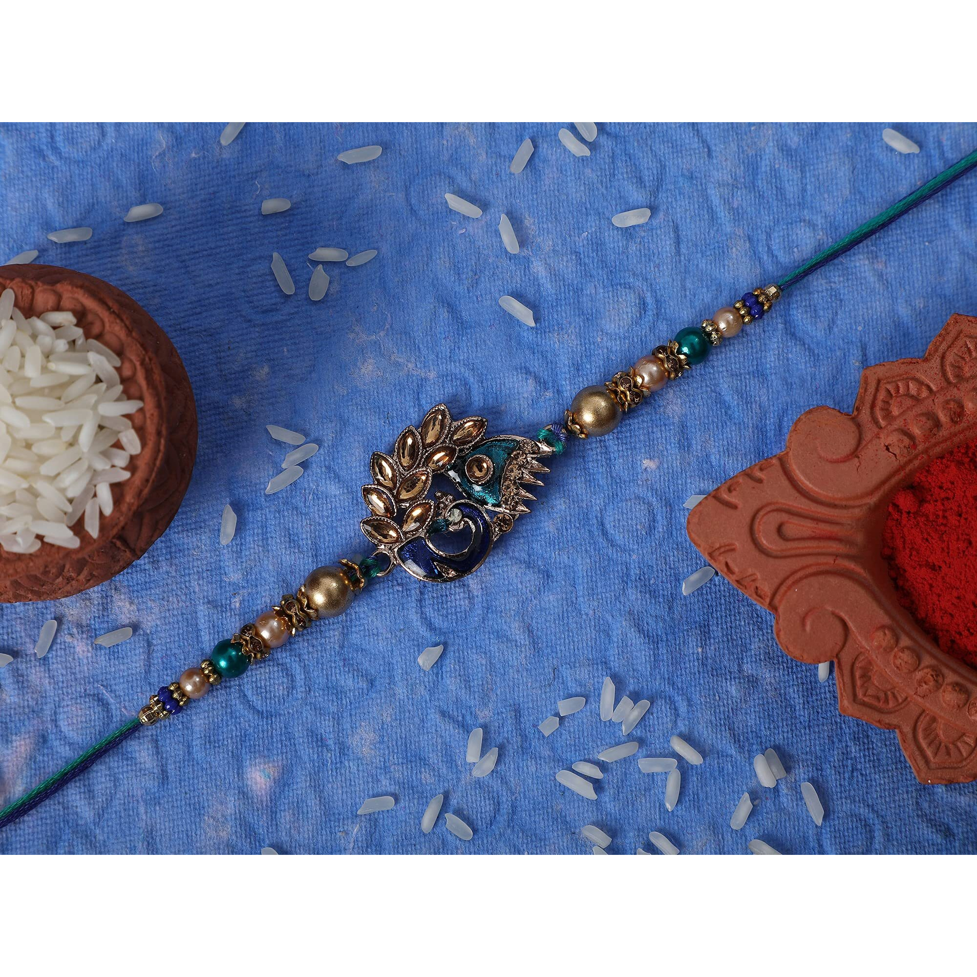 Riddhika Ventures Stylish Peacock Feather and Kundan Rakhi Bracelet with Roli Chawal and Greeting Card (K2)