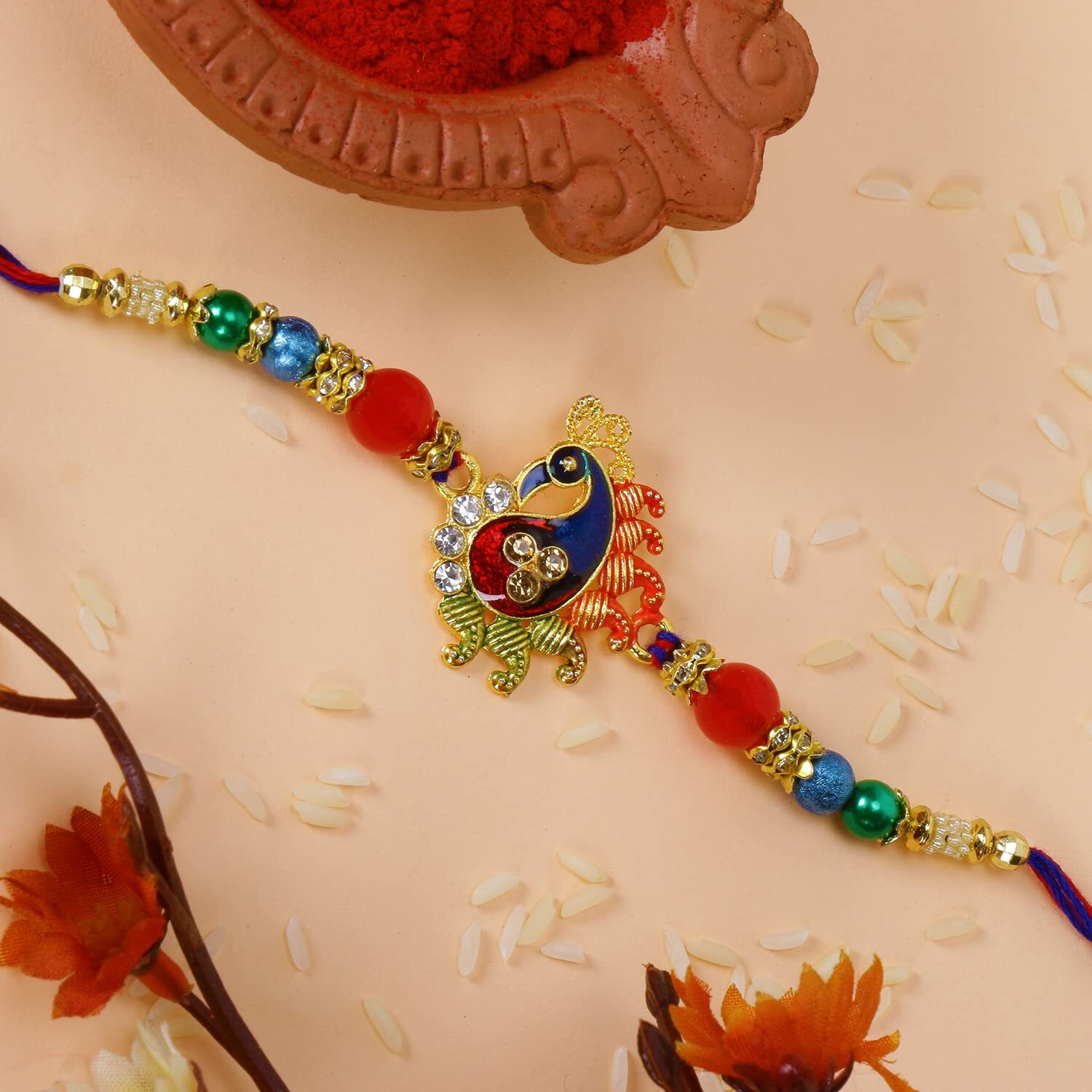 Riddhika Ventures Ravishing Gold Plated Meenakari OM and Peacock Rakhi (Set of 2) with Roli Chawal and Greeting Card(K6K9)
