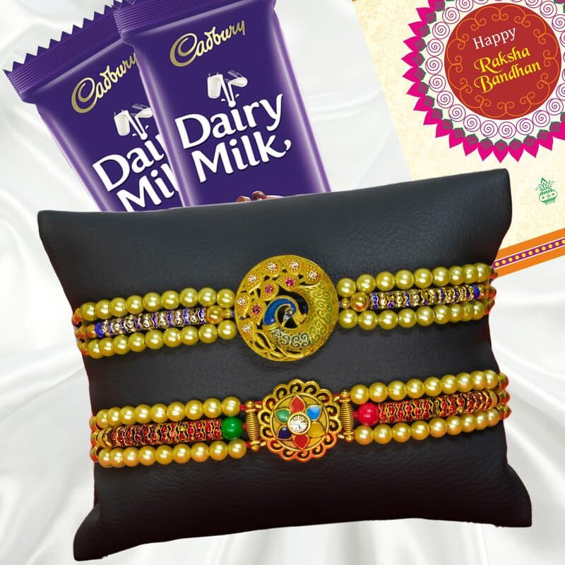 Canton Rakhi Combo Gift Hamper Pack of 2 Rakhi For Brother With Chocolate, Rakhi With Cadbury Dairy Milk, Greeting Card & Roli Tilak (Design-1, 2 Rakhi With Cadbury)