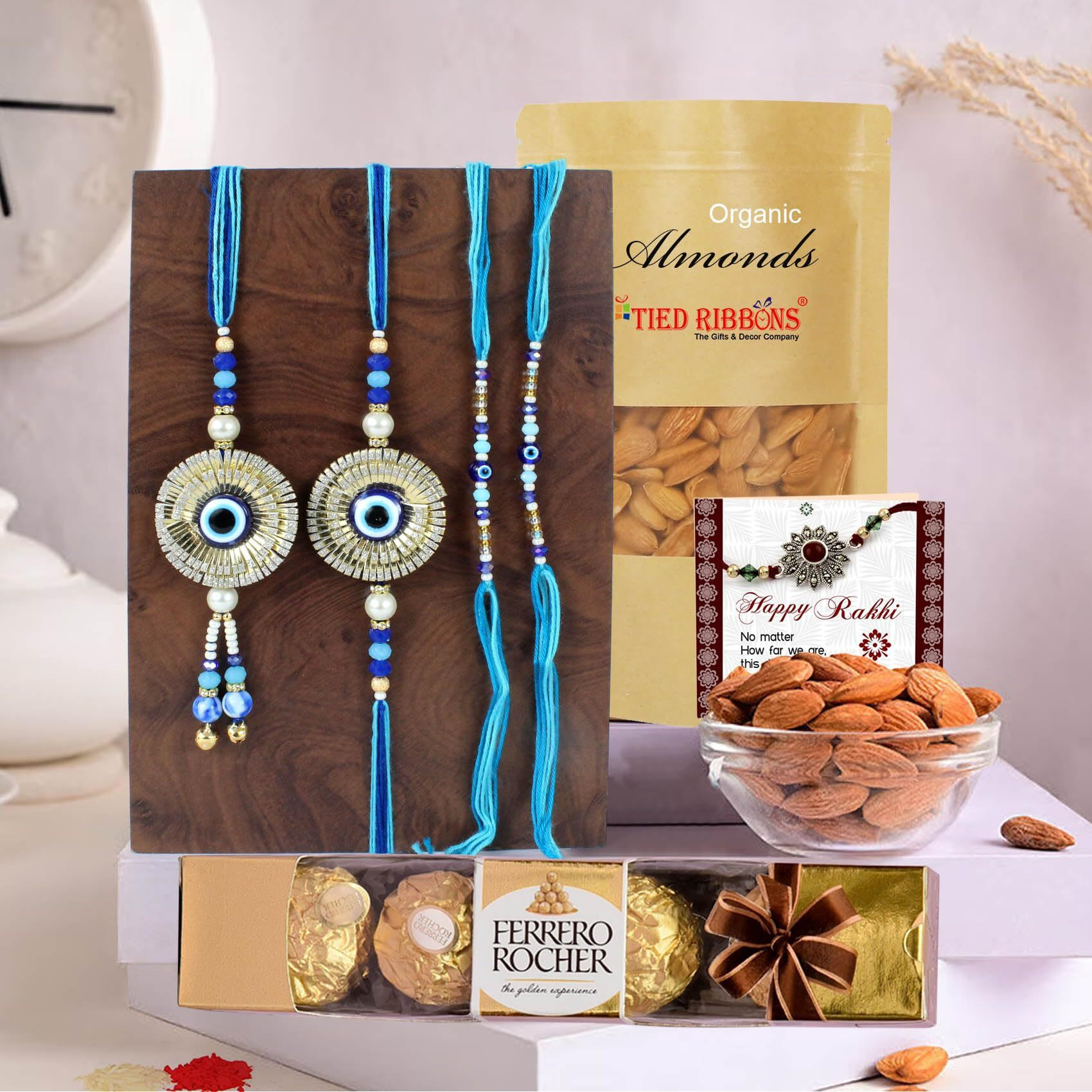 TIED RIBBONS Rakhi for Brother and Bhabhi Kids with Chocolate and Dry Fruit Gift Hamper - Evil Eye Family Rakhi Set of 4 with Ferrero Rocher Chocolates Almonds and Card - Rakhi Gift for Bhaiya Bhabhi