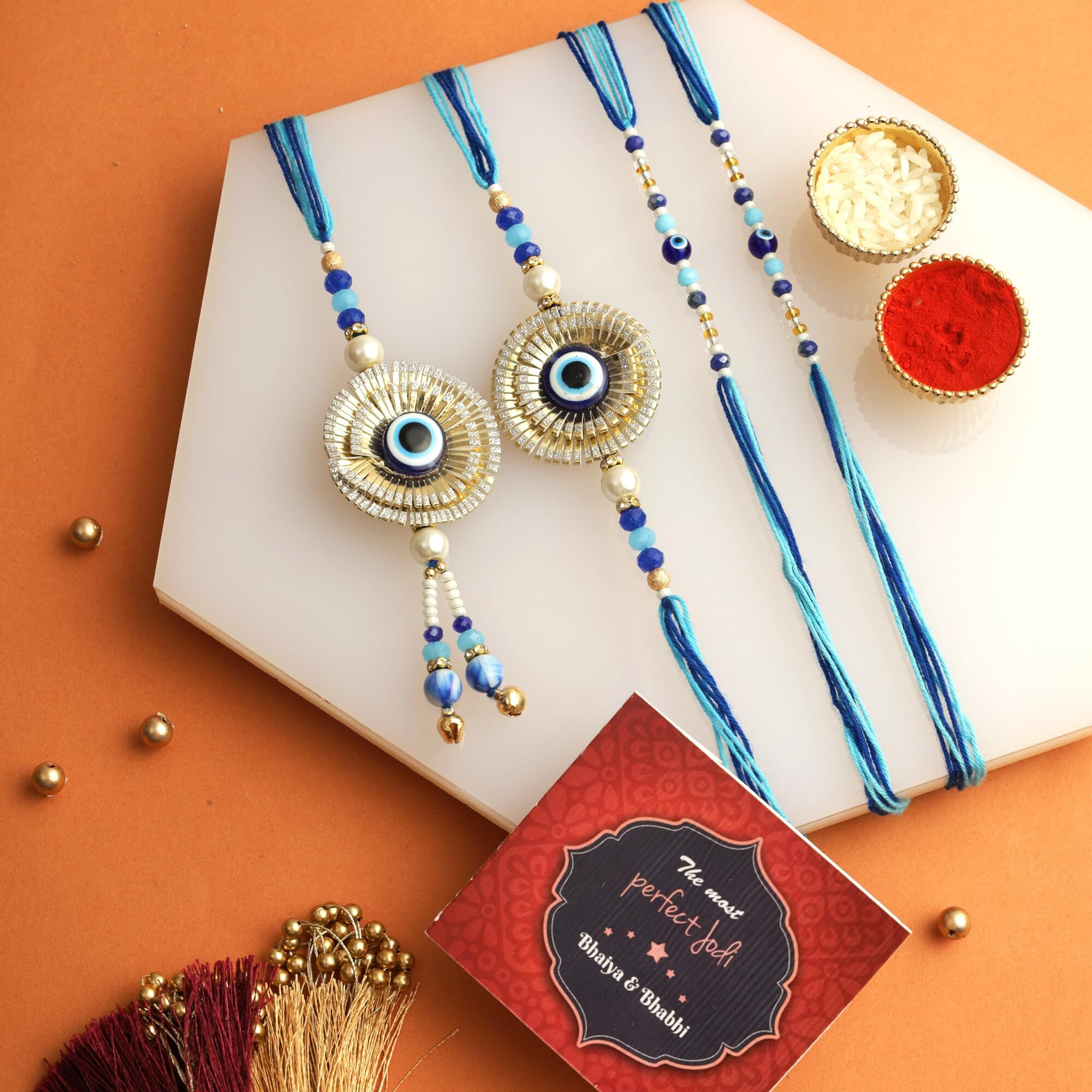 TIED RIBBONS Rakhi for Brother and Bhabhi Kids with Chocolate and Dry Fruit Gift Hamper - Evil Eye Family Rakhi Set of 4 with Ferrero Rocher Chocolates Almonds and Card - Rakhi Gift for Bhaiya Bhabhi