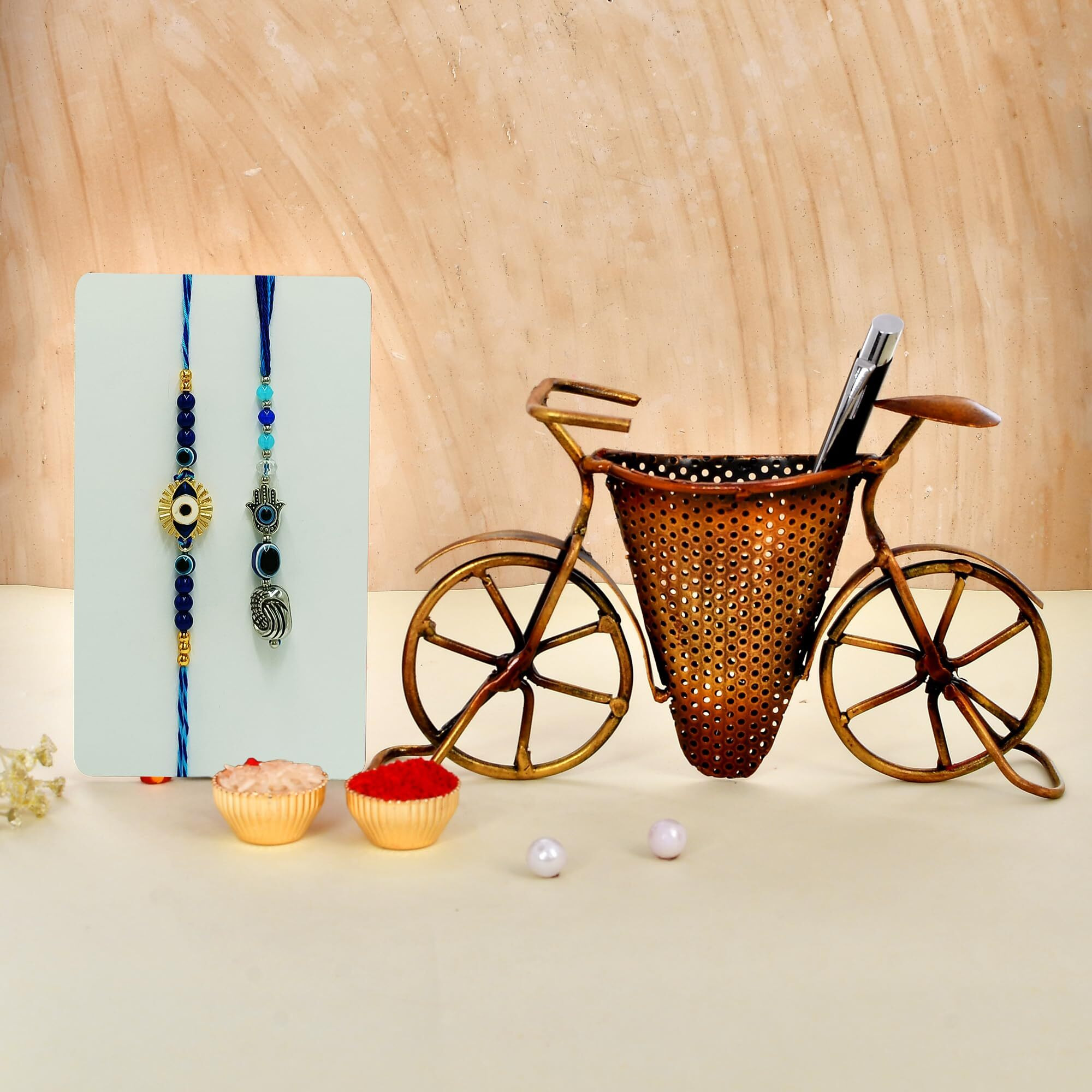CraftVatika Rakhi for Brother and Bhabhi Gift Combo Rakhi with Cycle Penstand Showpiece for Home Dcor Item, Evil Eye Rakhi for Bhaiya Bhabhi Rakhi Combo Set for Bhai