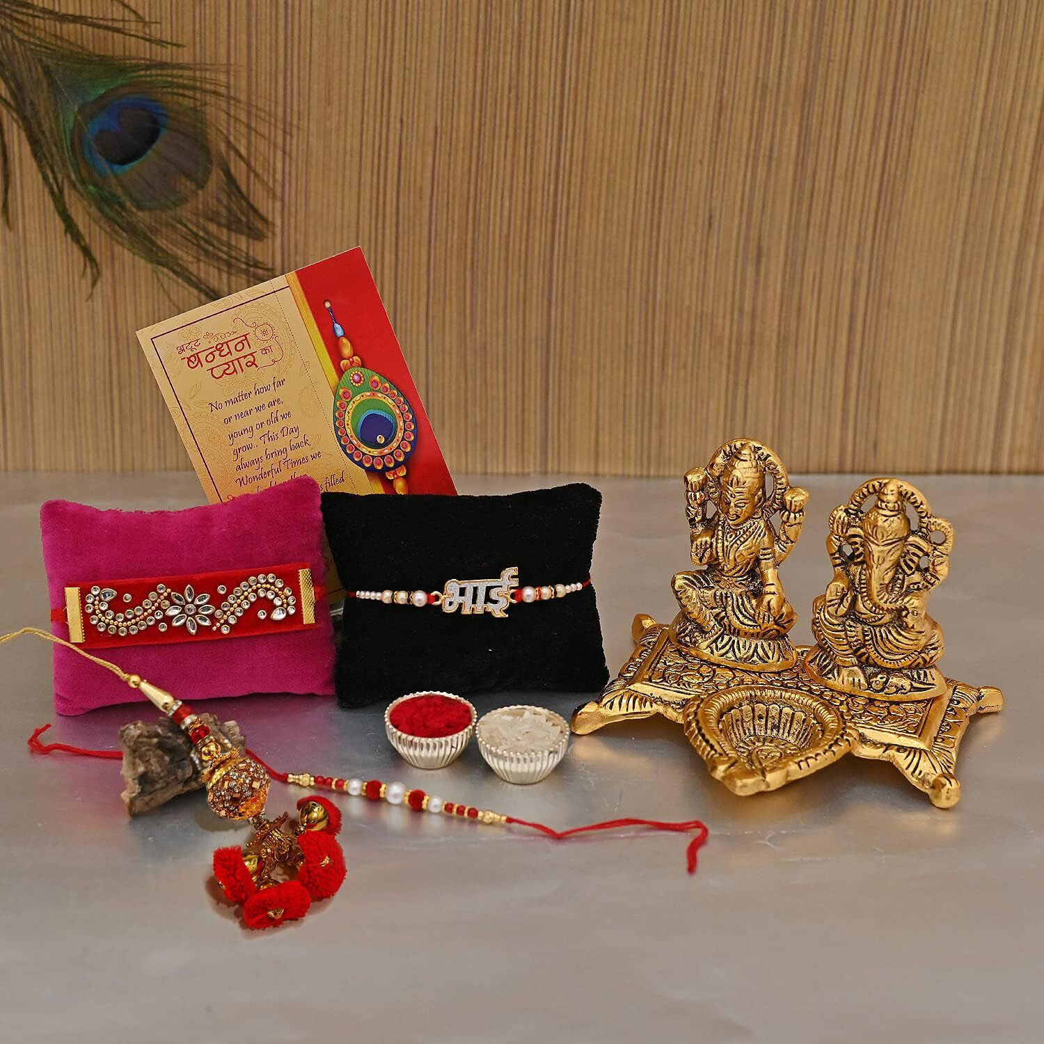 Collectible India Rakhi gift Combo of Metal Golden Laxmi Ganesh Showpiece Oil Lamp Diya, Bhai Rakhi, Lumba Rakhi and Greeting Card