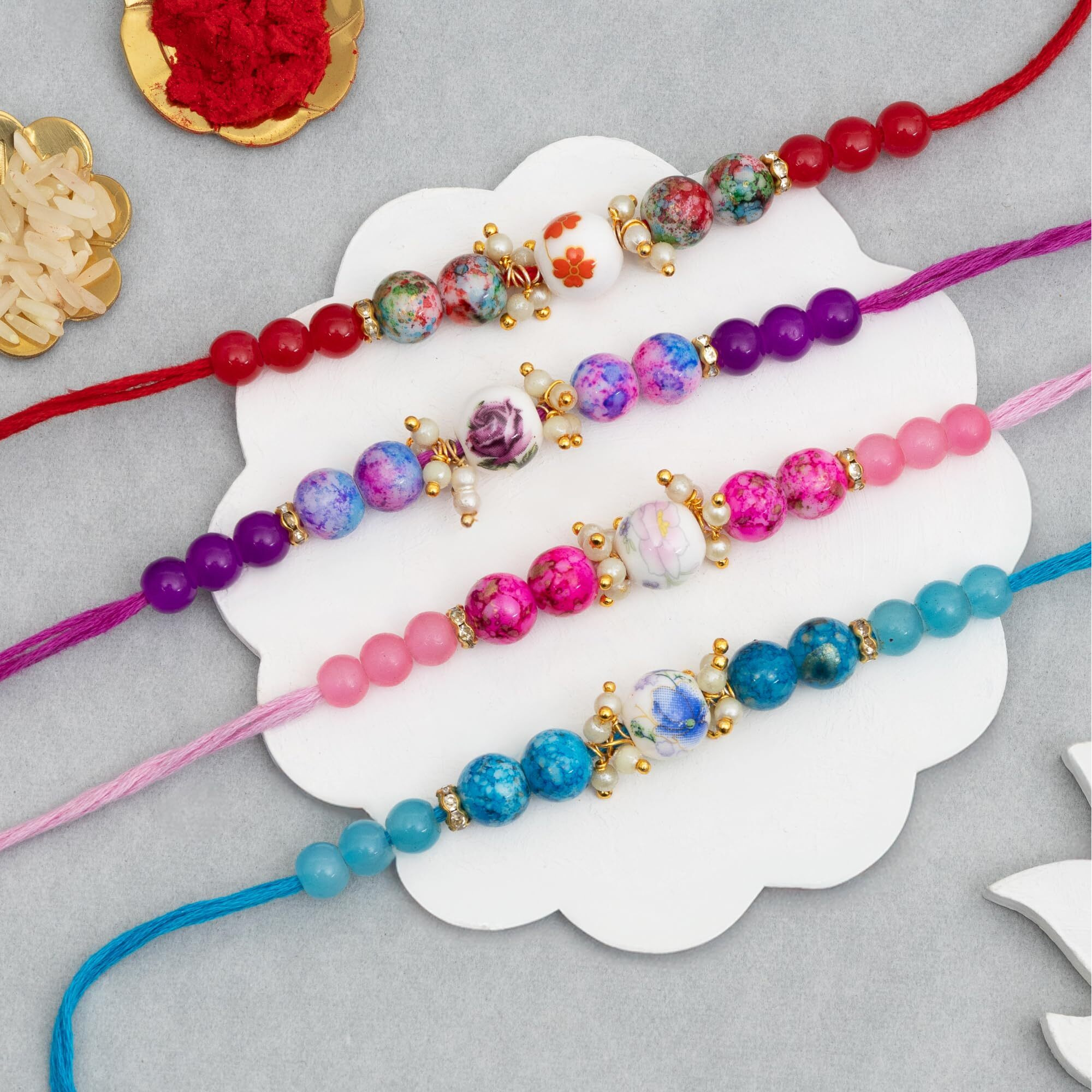 To The Nines Rakhi for Brother with Greeting Card and Tialk Material - Pack of 4 Rakhi