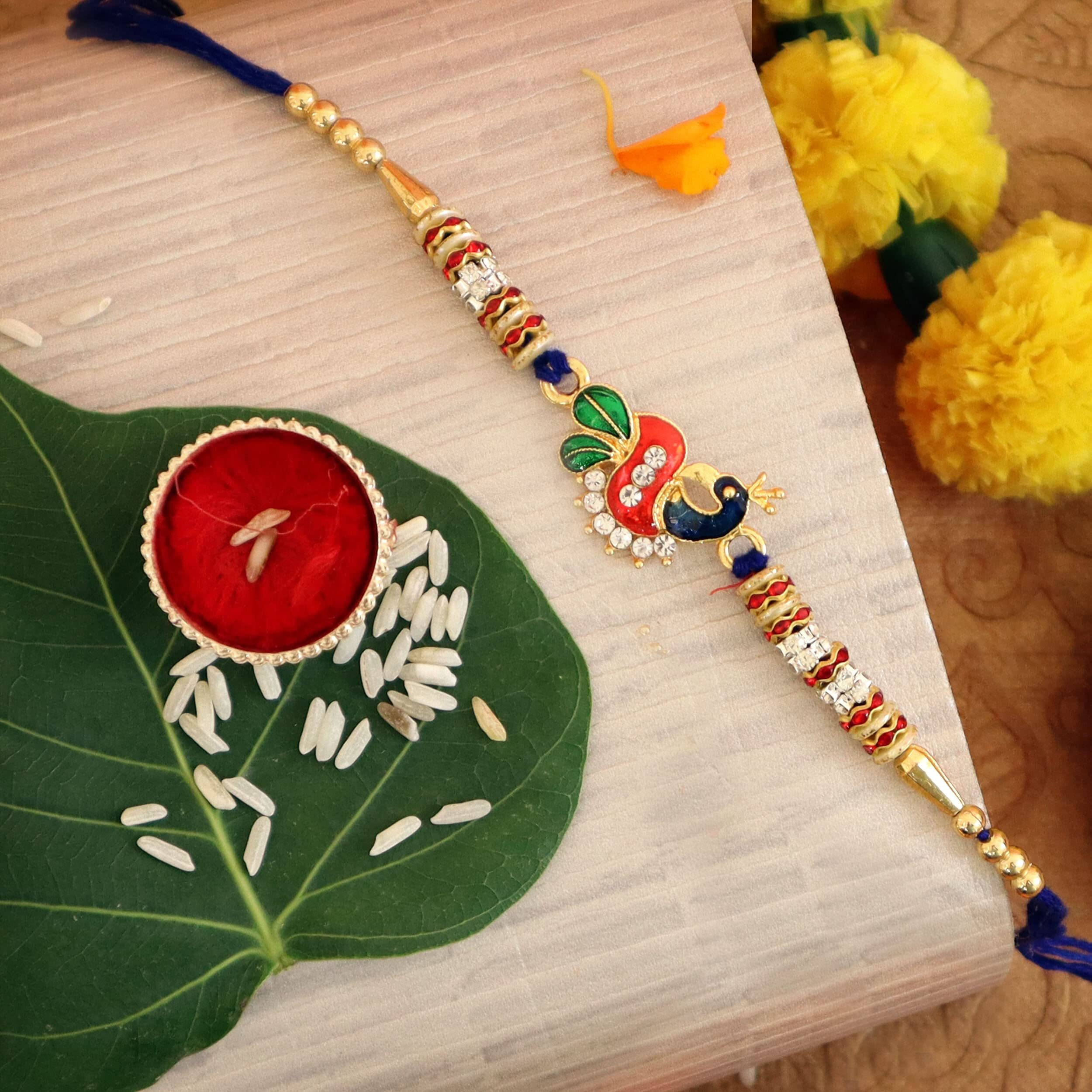 TIED RIBBONS Rakhi for Kids with Chocolate Gift Pack - Peacock Rakhi for Kids with Cadbury Celebrations Chocolates and Roli Chawal Tikka