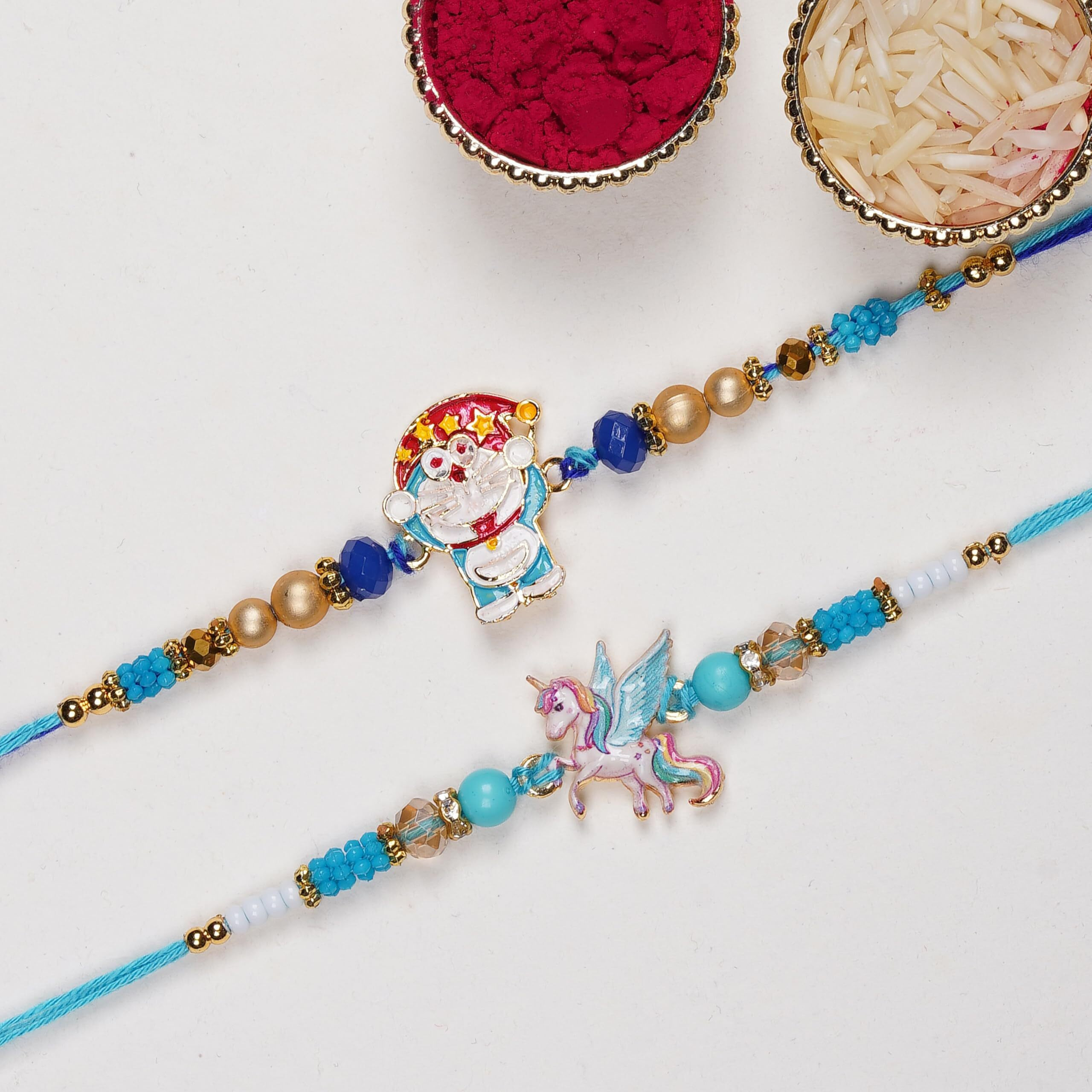 Finemoe 2 Pc Unicorn And Dora Rakhi Set For Brother, Kids Cartoon Thread Bracelets Combo, Handmade Resin Charm Child Rakshabandhan Hamper With Complimentary Roli Chawal, Festive Gift Kit For Children